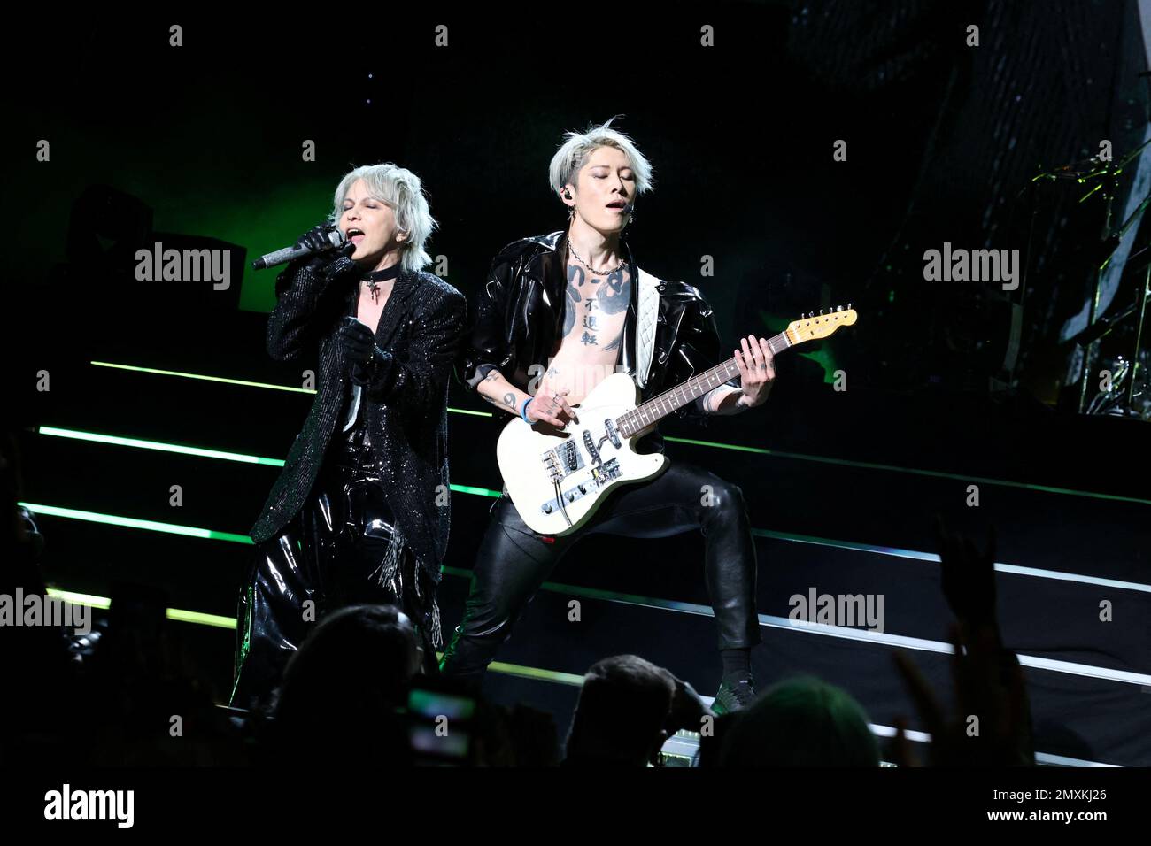 Japanese rock artists HYDE and MIYAVI perform with members of