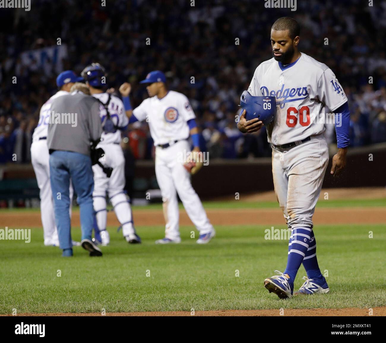 Los Angeles Dodgers' Andrew Toles (60) walks off the field after Game 1 of  the National League baseball championship series against the Chicago Cubs  Saturday, Oct. 15, 2016, in Chicago. Cubs won