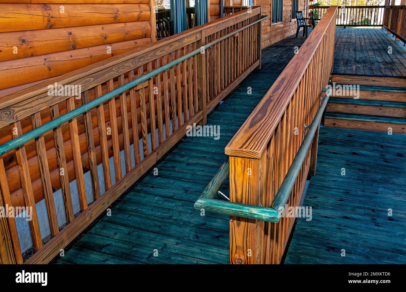 Log building with wheelchair handicapped wooden access ramp Stock Photo ...