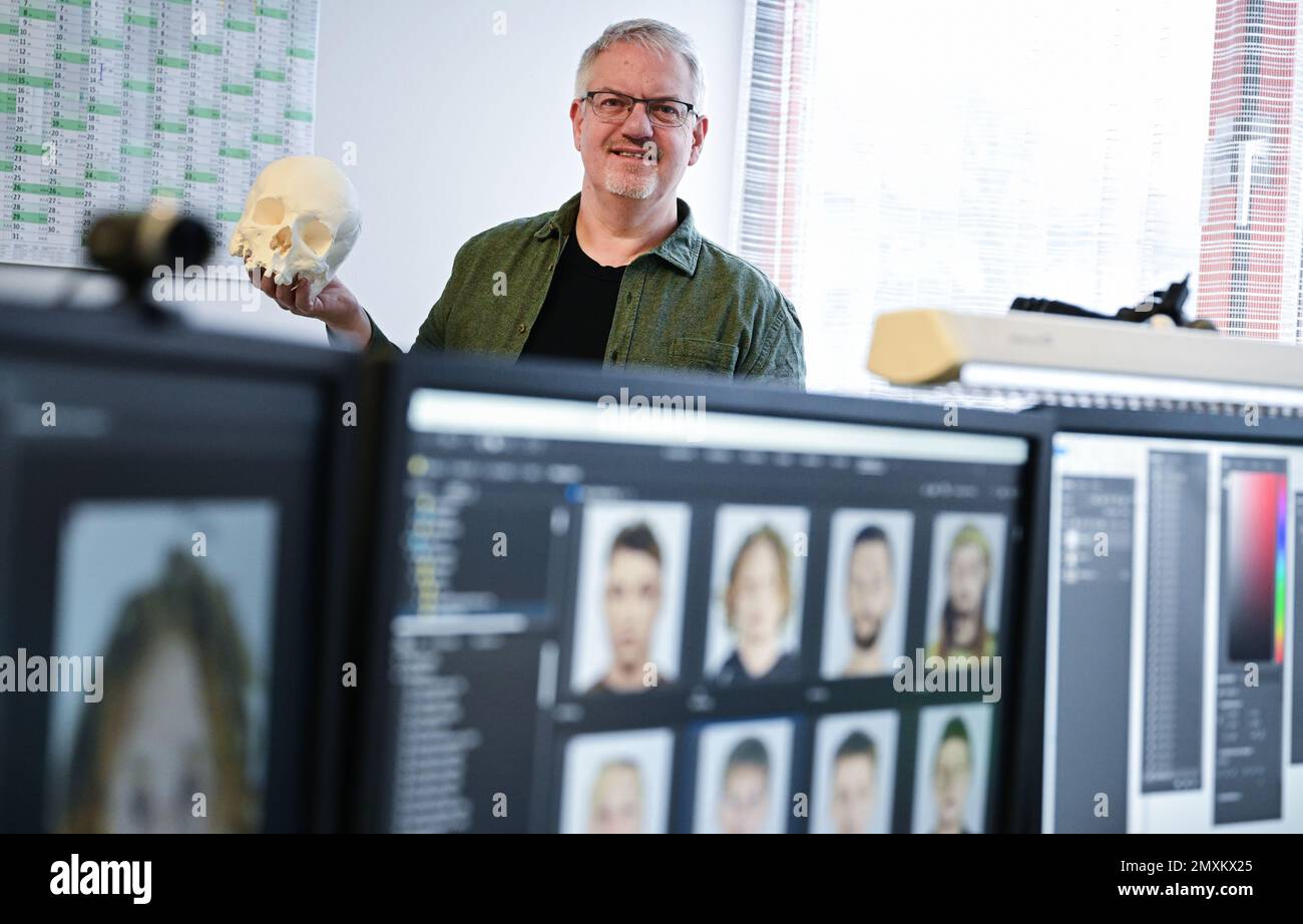 Stuttgart, Germany. 03rd Feb, 2023. Rainer Wortmann, head of the sketch artists in Baden-Württemberg, holds a model of a skull in his study at the Baden-Württemberg State Criminal Police Office. The model was created with a 3D printer. (to dpa: 'Phantom sketches - giving crime a face') Credit: Bernd Weißbrod/dpa/Alamy Live News Stock Photo