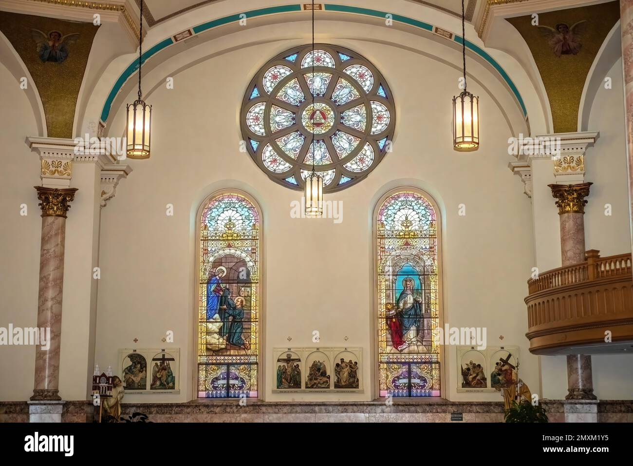 St. Simon Stock on left, St. Hedwig, on right, Rose window of The Trinity above on West Transept Wall of Basilica of St. Stanislaus Catholic Church. Stock Photo
