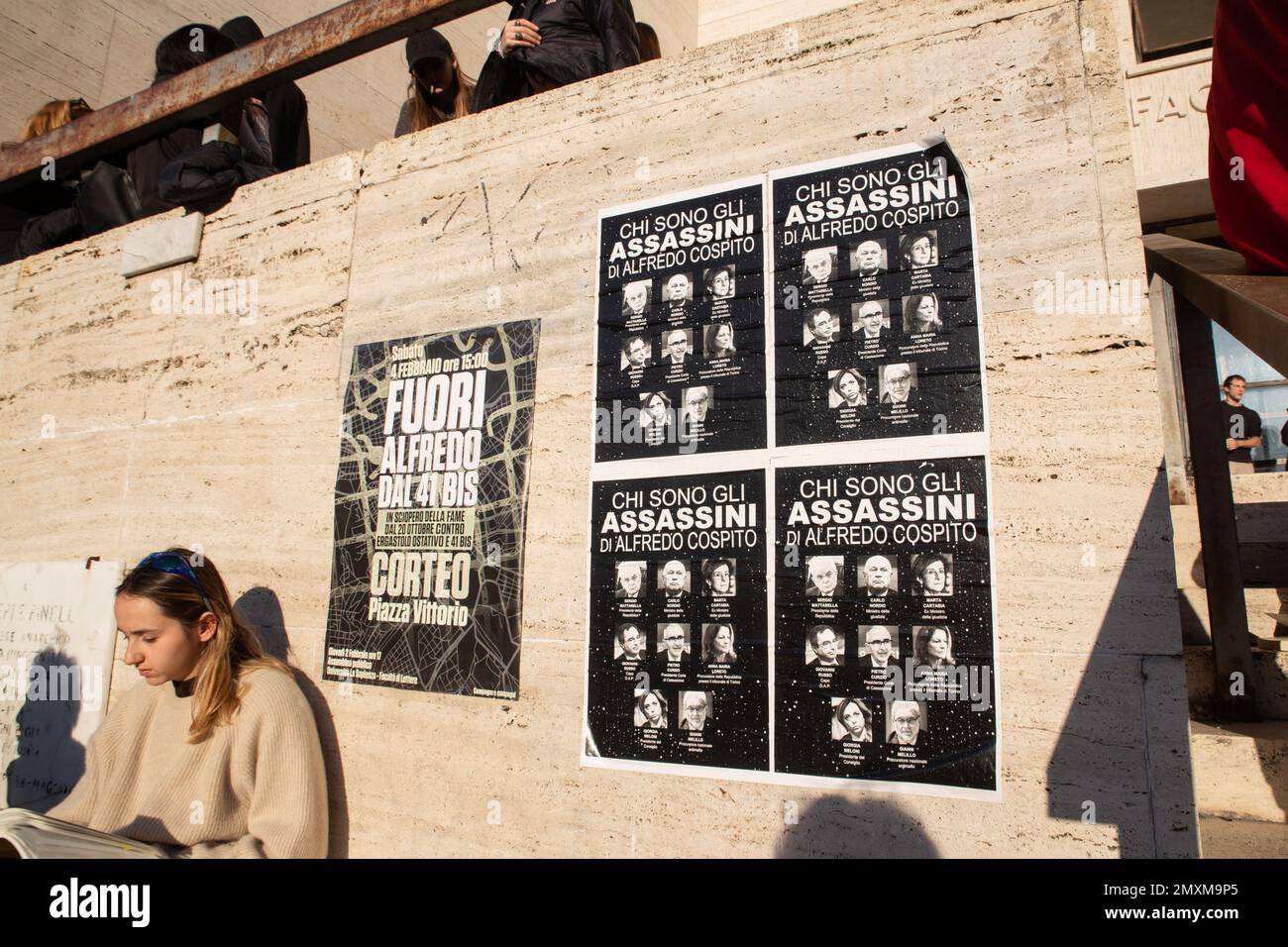 Posters in solidarity with anarchist Alfredo Cospito posted at the