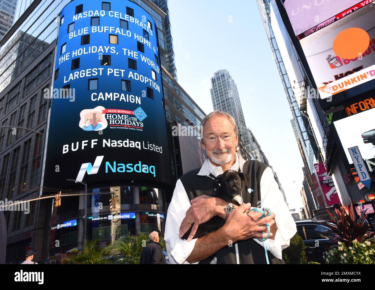 IMAGE DISTRIBUTED FOR BLUE BUFFALO Bill Bishop Founder Chairman of Blue Buffalo poses with an adoptable puppy to launch the Blue Buffalo Home 4 the Holidays pet adoption campaign Wednesday