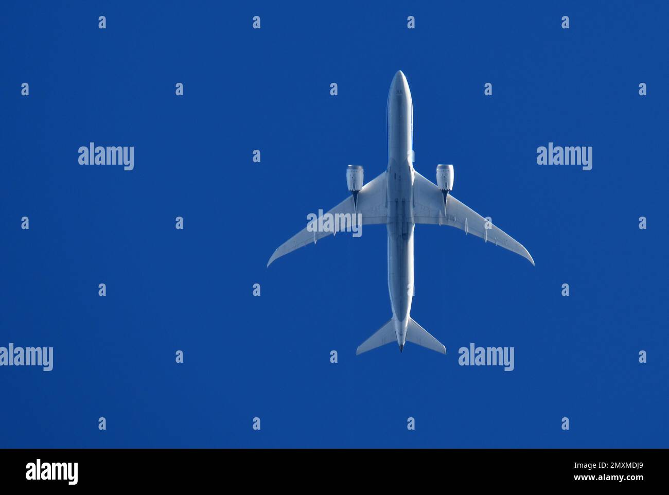 A passenger plane flying overhead Stock Photo Alamy