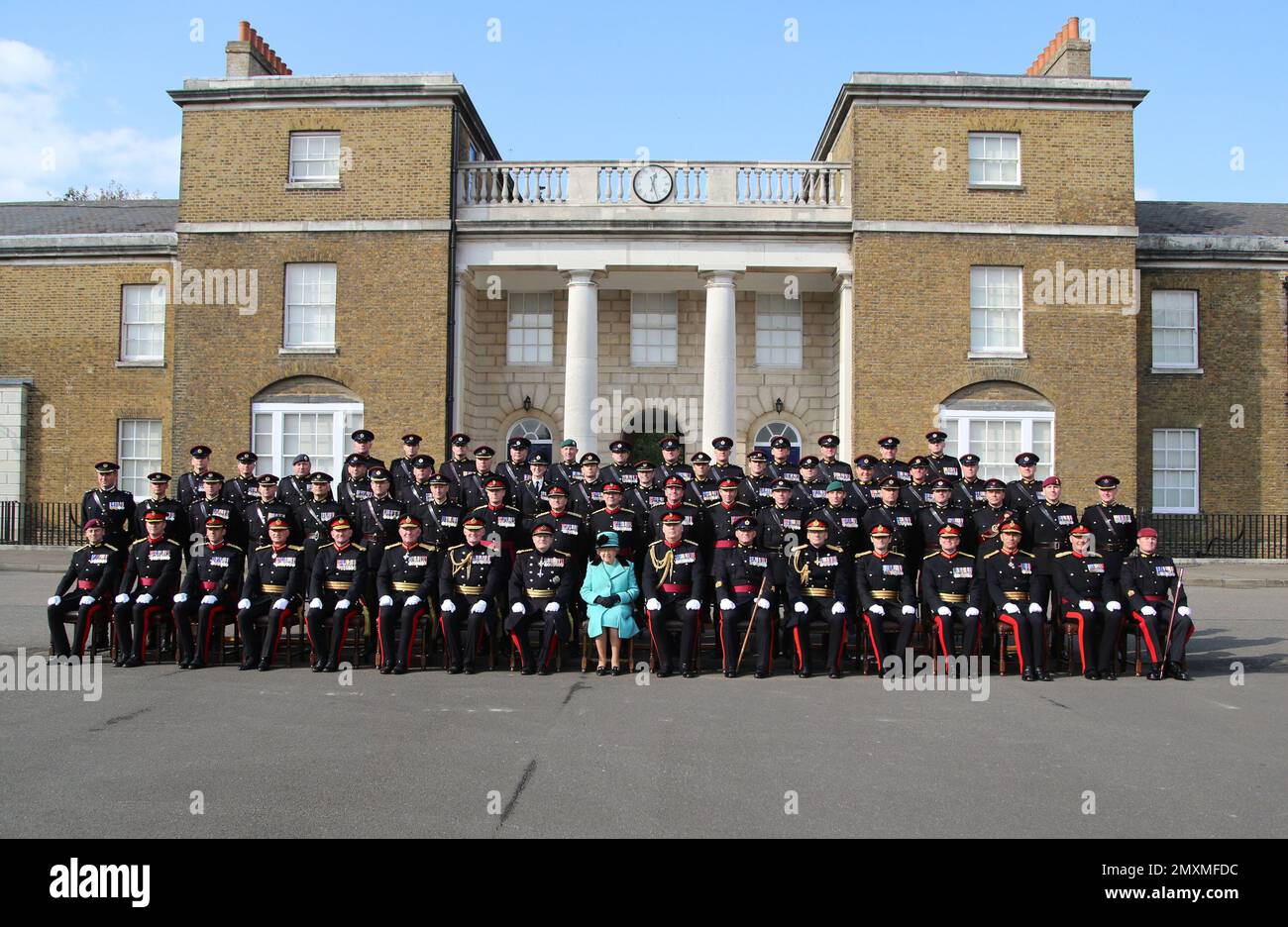 Britain's Queen Elizabeth II, poses for a group photograph, during a visit to the Corps of Royal Engineers at Brompton Barracks to celebrate their 300th anniversary, in Chatham, Kent, England, Thursday Oct. 13, 2016. (Gareth Fuller/Pool Photo via AP) Stock Photo