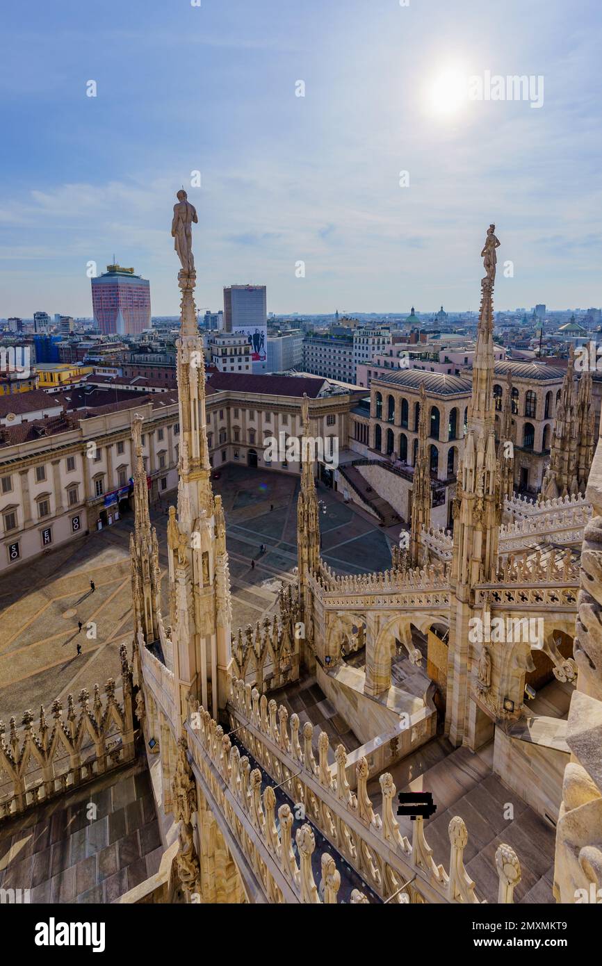 Milan, Italy - March 02, 2022: View from the Cathedral (Duomo) terraces on the palace yard, with locals and visitors, in Milan, Lombardy, Northern Ita Stock Photo