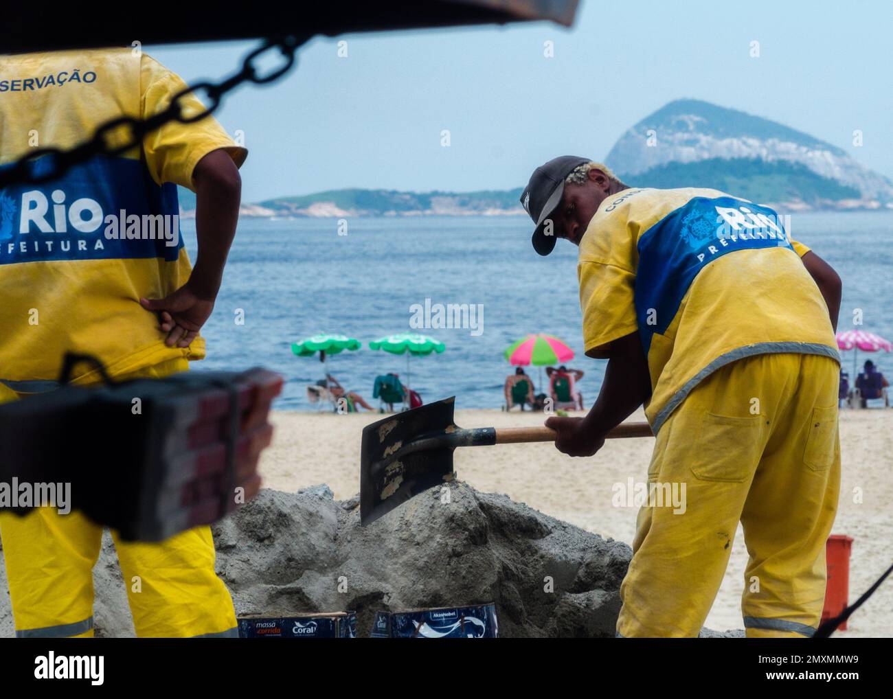 Rio de Janeiro, Brazil - February 3, 2023: A street worker repairs the cobblestone pavement in Ipanema, Rio de Janeiro, Brazil Stock Photo