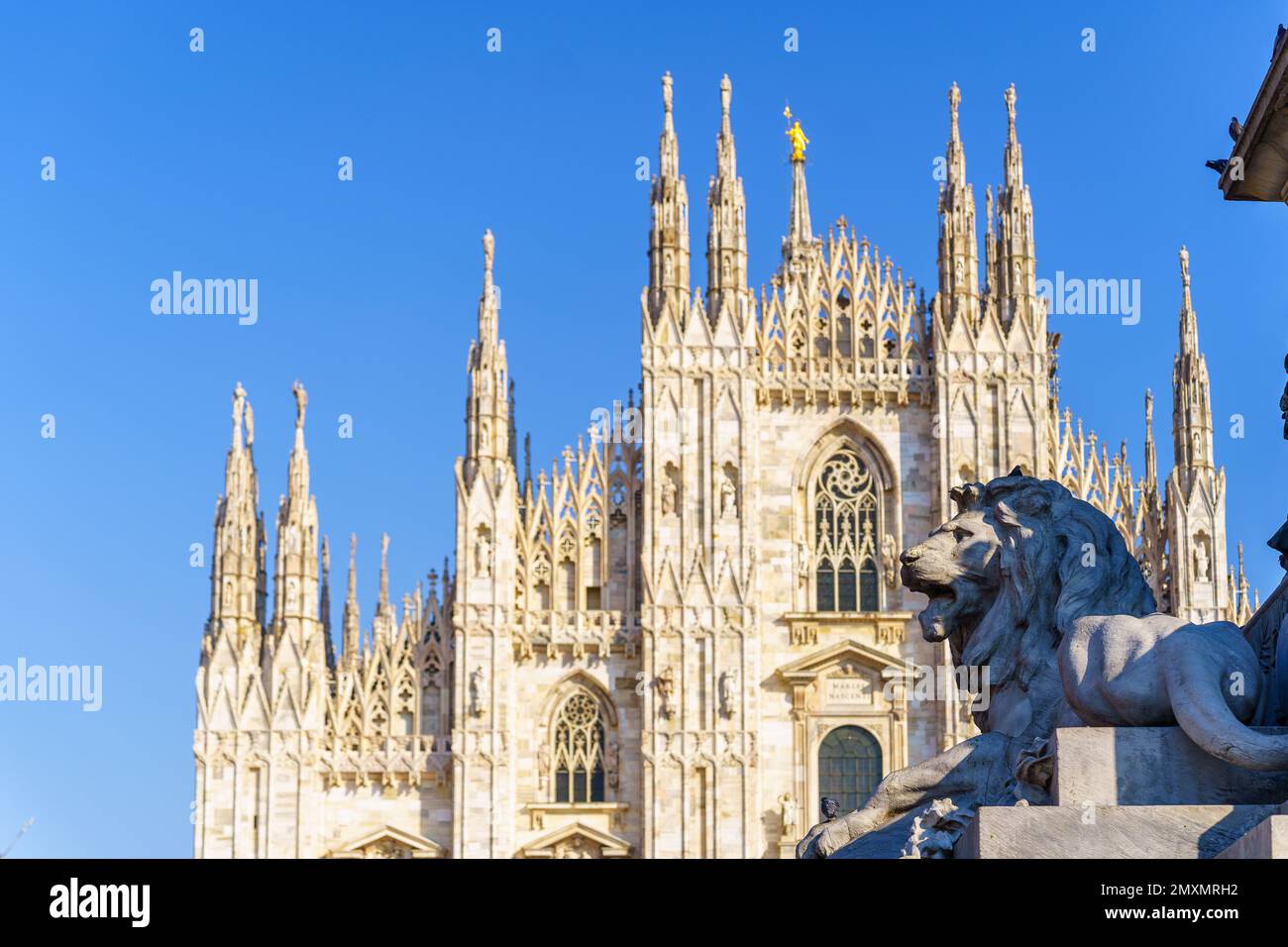 View of the Statue for Vittorio Emanuele II (dated 1879), and the Cathedral (Duomo) in the background, in Milan, Lombardy, Northern Italy Stock Photo