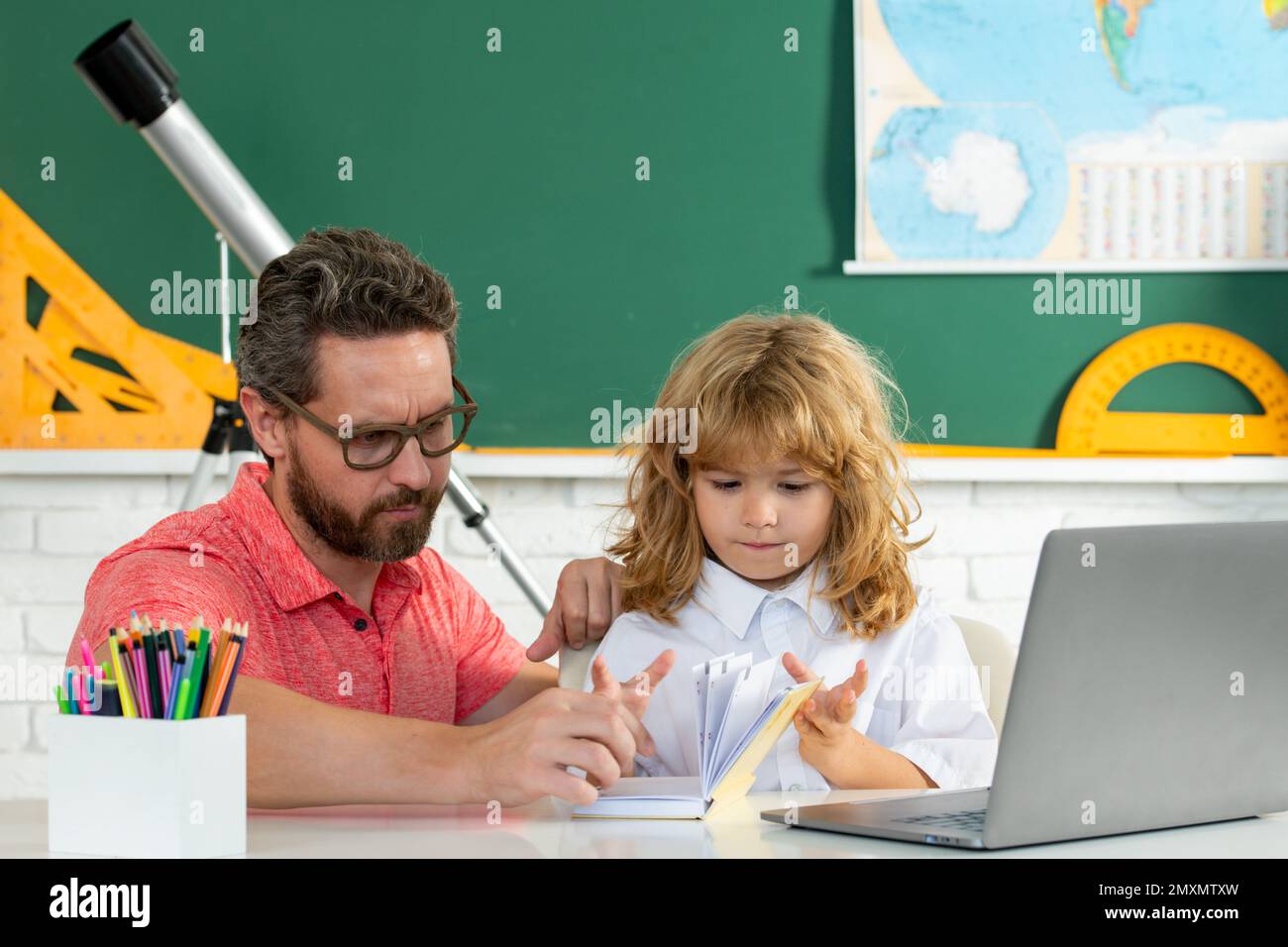 School education and children concept. Teacher helping child student ...