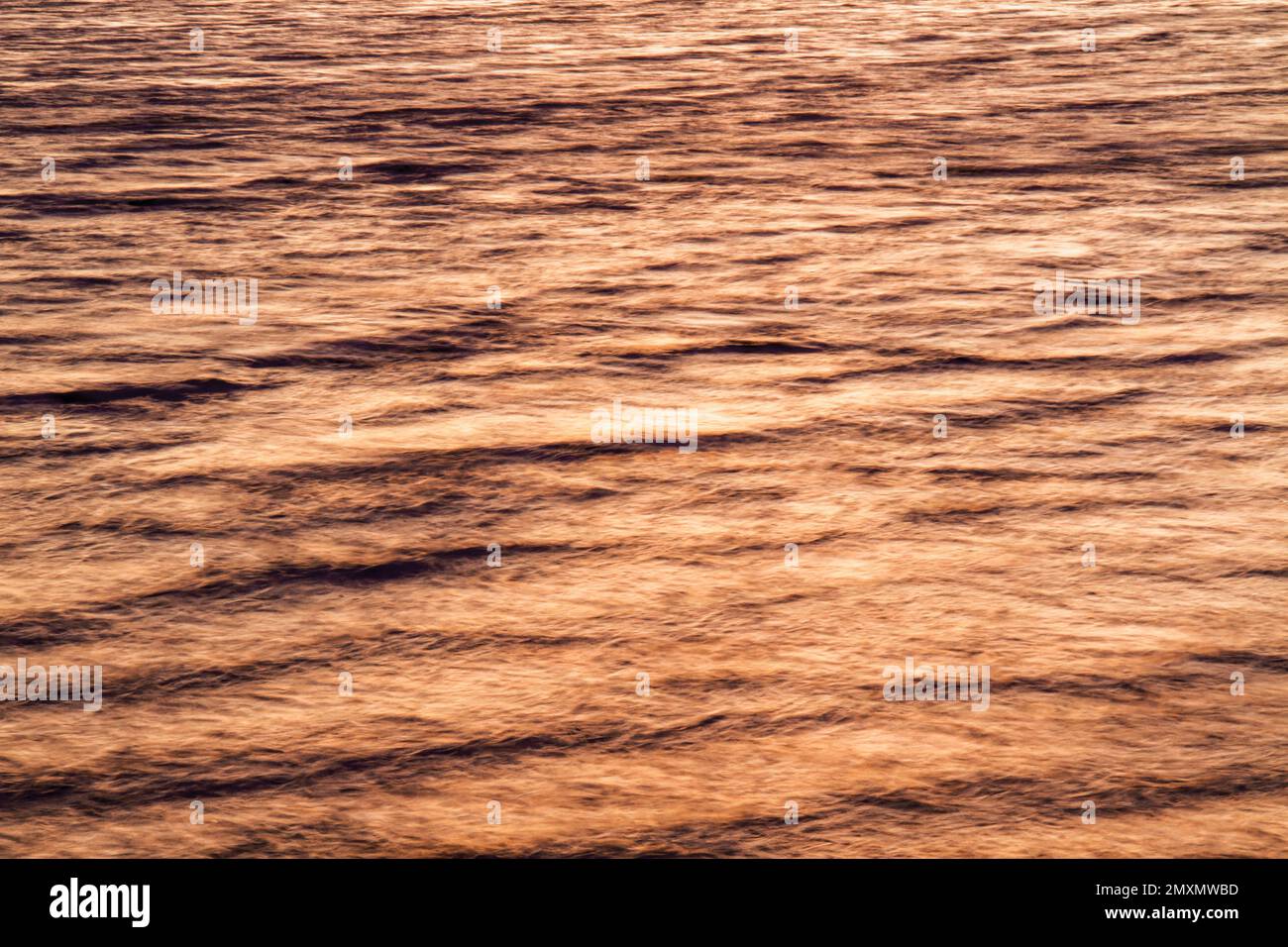 Reflecting sunset light off the surface of the water (2014) Stock Photo