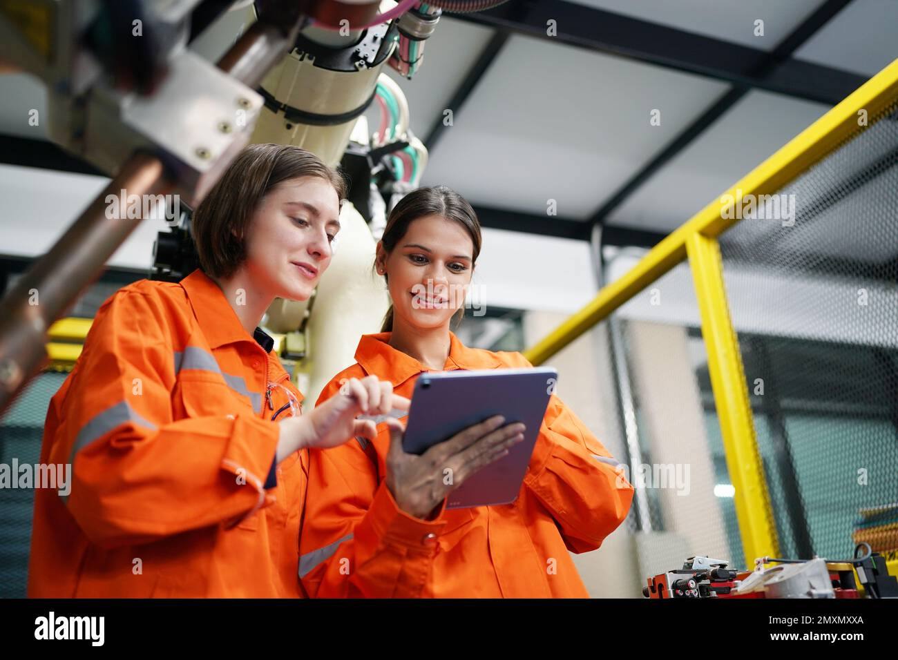 Engineers Maintenance Robot Arm at Lab in a High Tech Research
