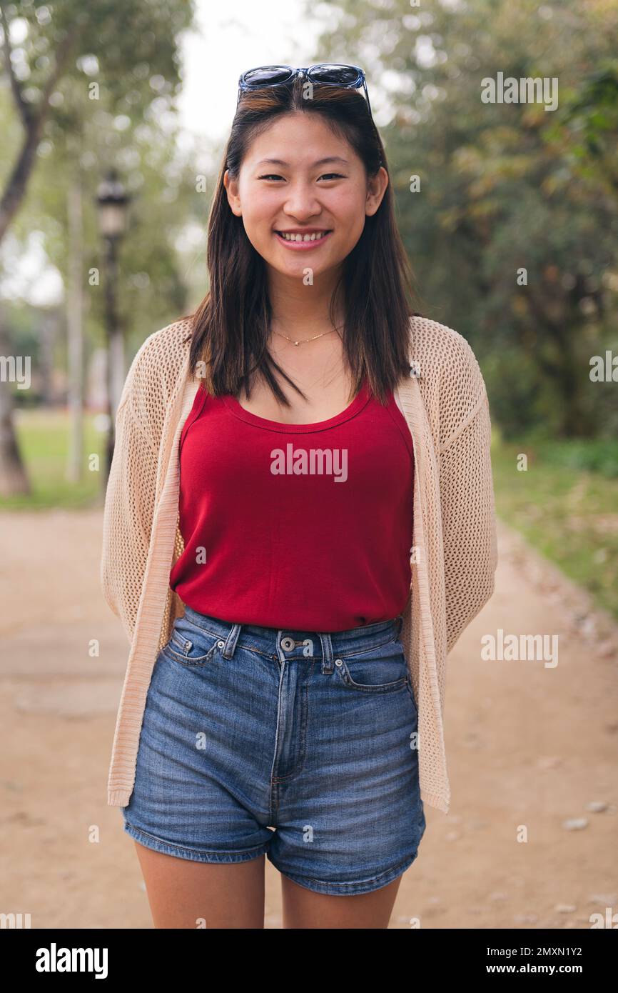 beautiful young asian woman looking at camera Stock Photo - Alamy