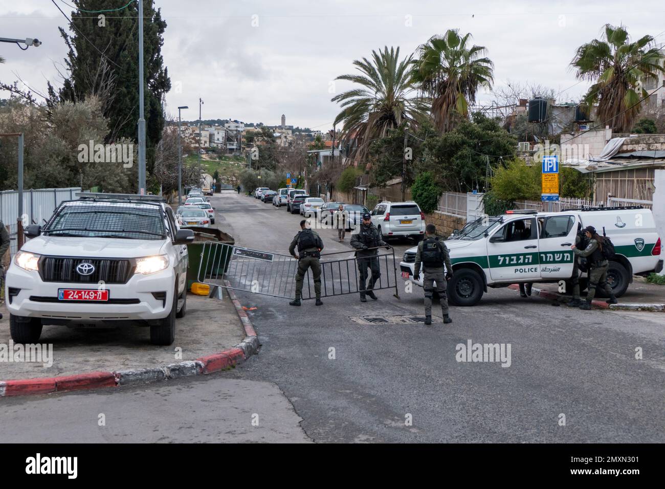 Members of the Israeli security force block a road in Sheikh Jarrah a predominantly Palestinian