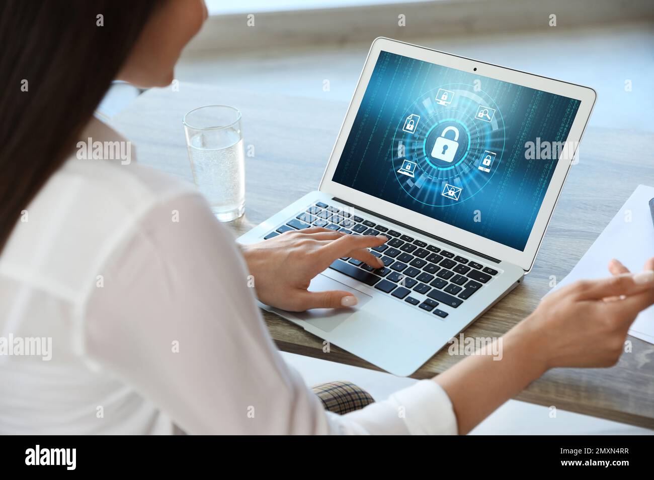 Cyber security concept. Woman using application on laptop, closeup Stock Photo