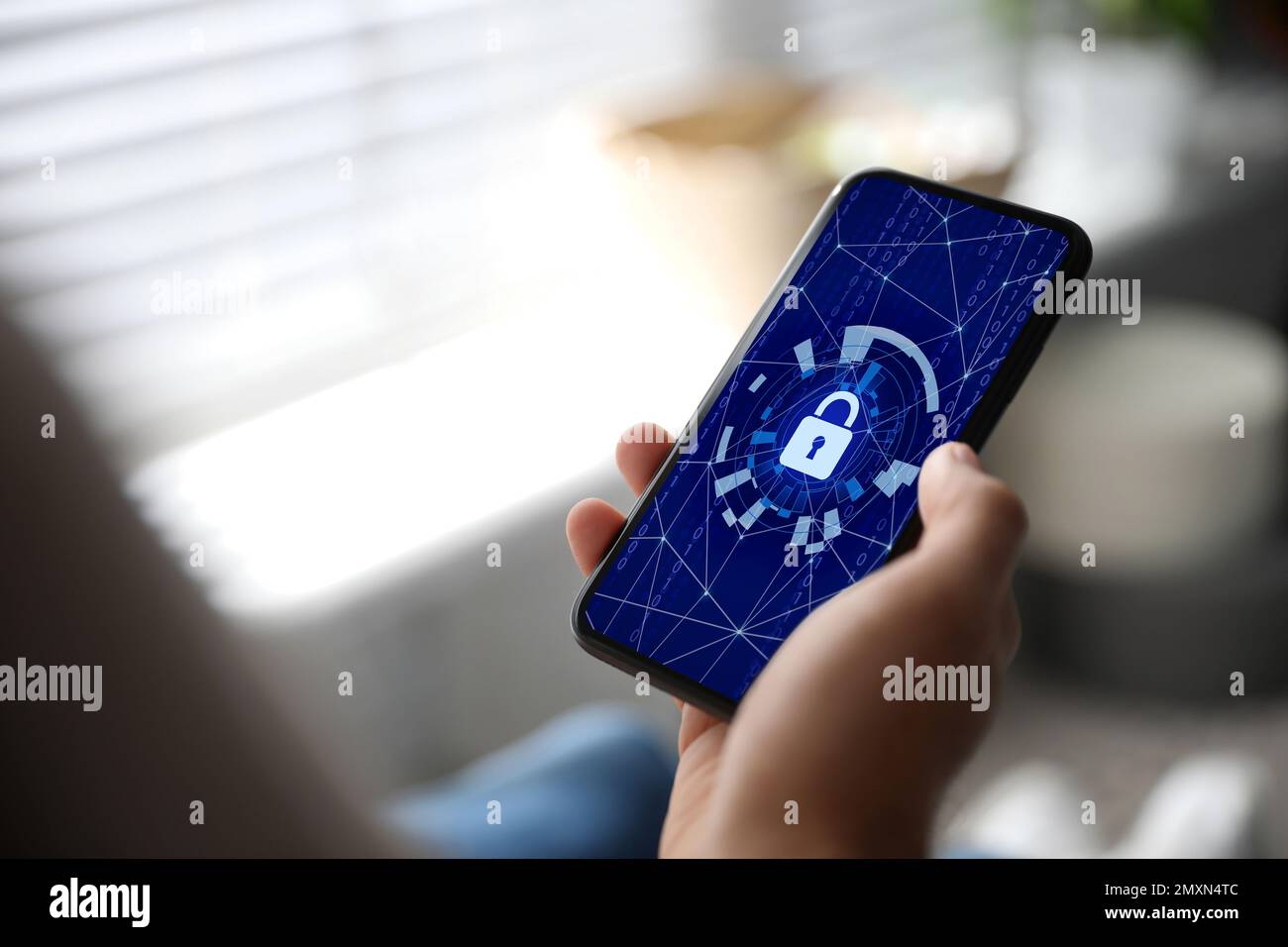 Cyber security concept. Man using application on phone, closeup Stock Photo