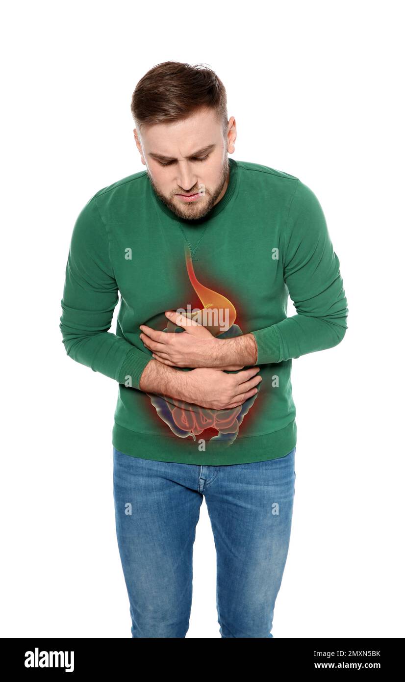 Young man suffering from stomach pain isolated on white Stock Photo Alamy