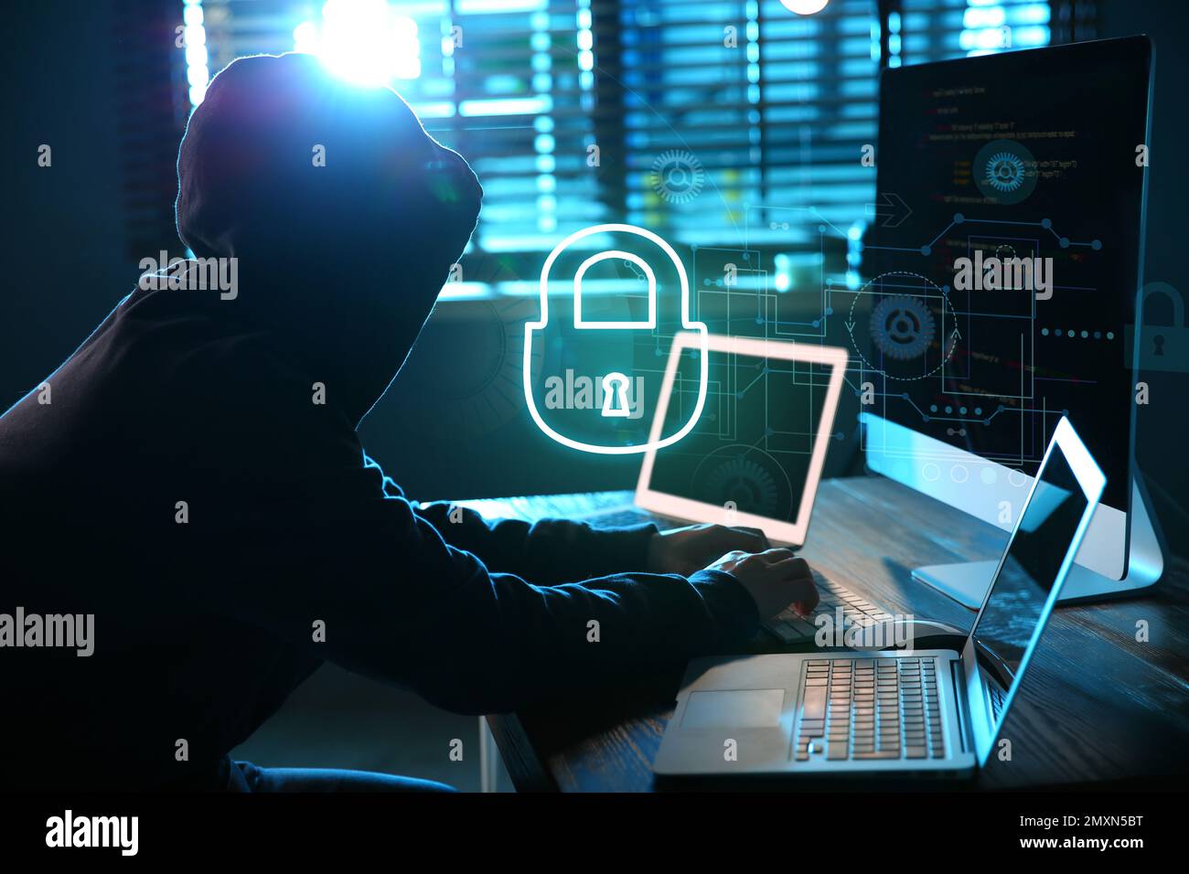 Cyber attack protection. Hacker with computers in room. Lock ...