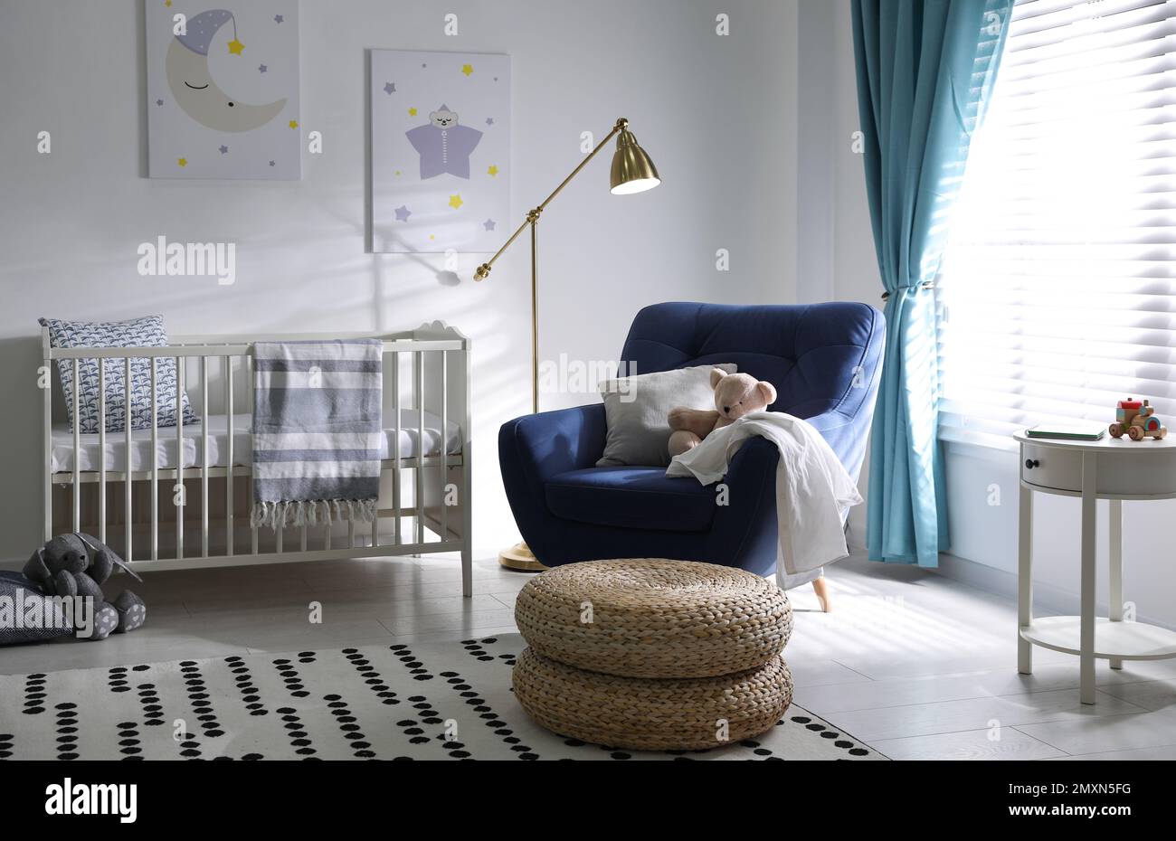Cozy baby room interior with comfortable armchair Stock Photo - Alamy
