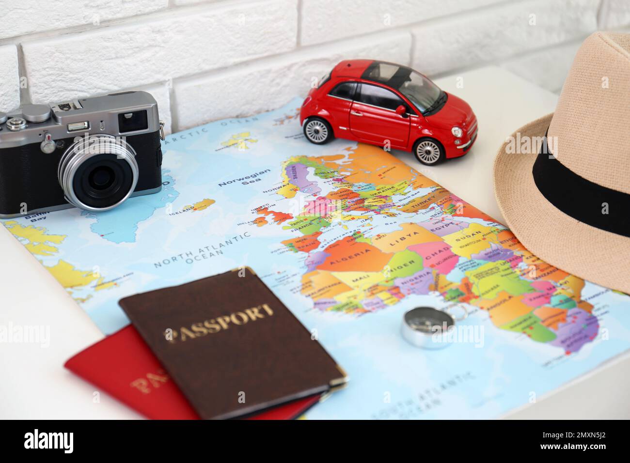 Composition with world map and different items on table. Trip planning Stock Photo
