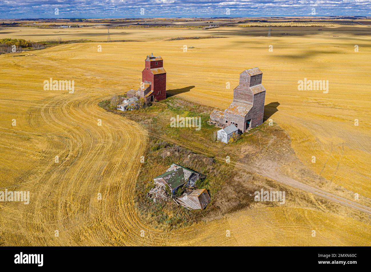 An aerial view over the Lepine Grain Elevators in the yellow field