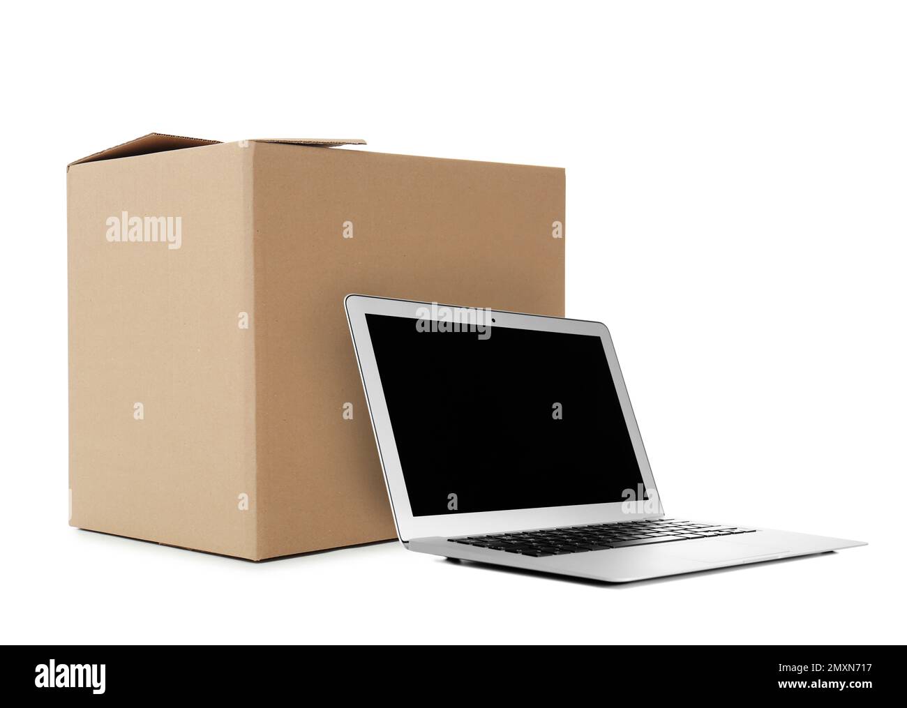 Online selling. Laptop and parcel on white background Stock Photo