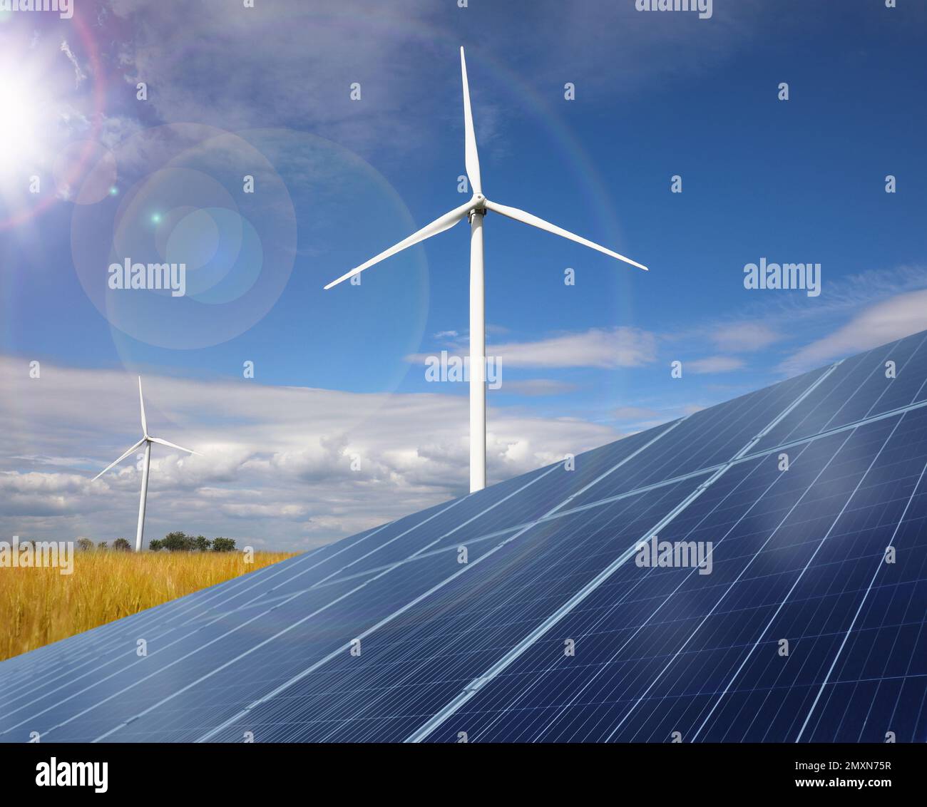 Solar panels and wind turbines installed outdoors. Alternative energy ...