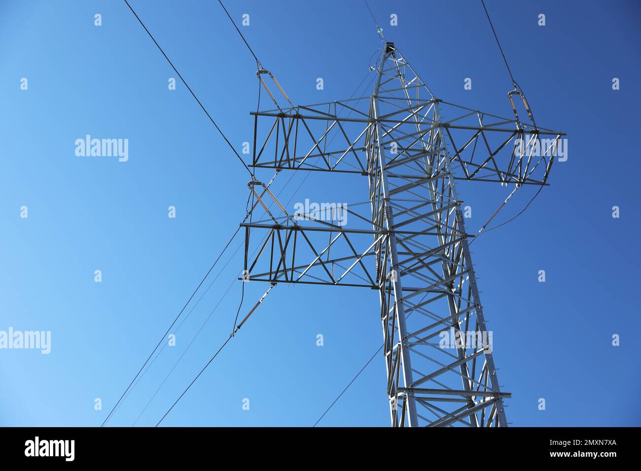 Modern high voltage tower against blue sky Stock Photo - Alamy