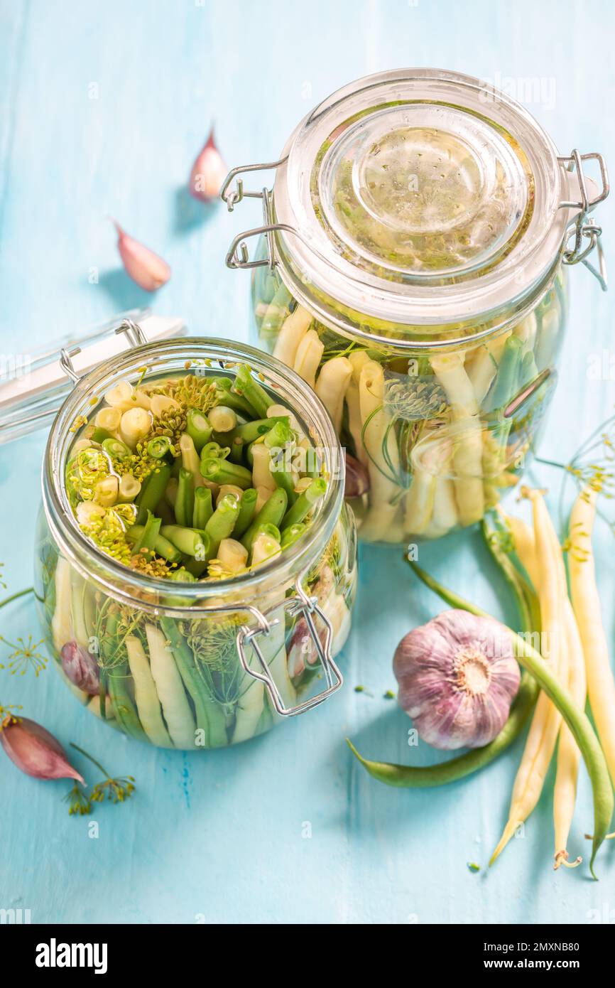 Homemade pickled yellow and green beans with galic and dill. Pickling