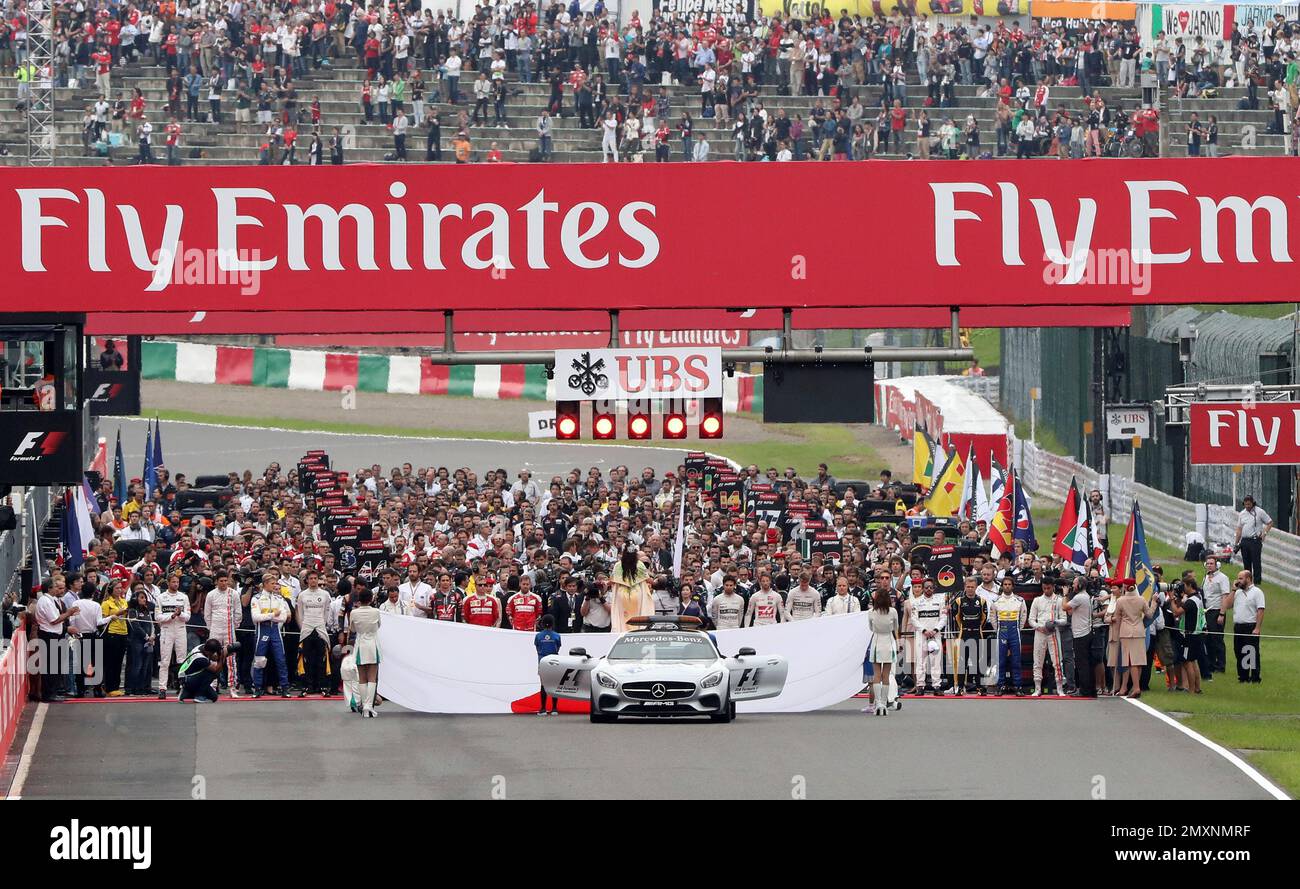 Drivers and their teams line up on the start grid ahead of the Japanese ...