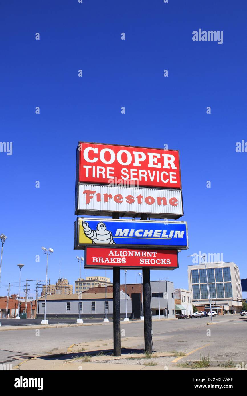 COOPER Tire Service sign with blue sky Stock Photo
