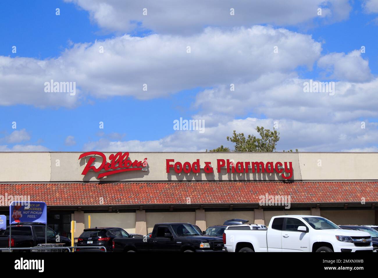 Dillons grocery store advertisement sign with blue sky and clouds Stock