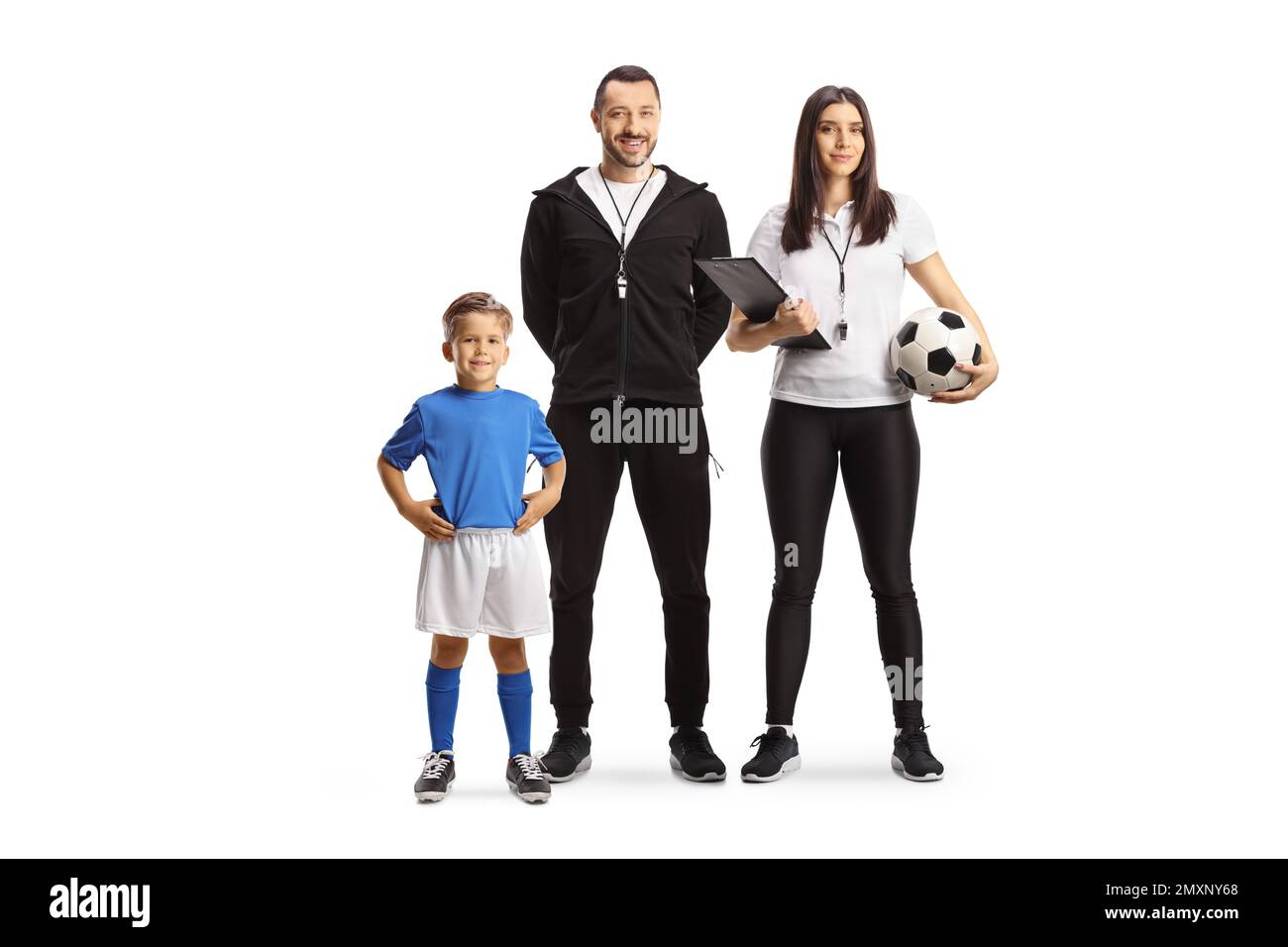Boy posing next to a football coach and a female assistant isolated on