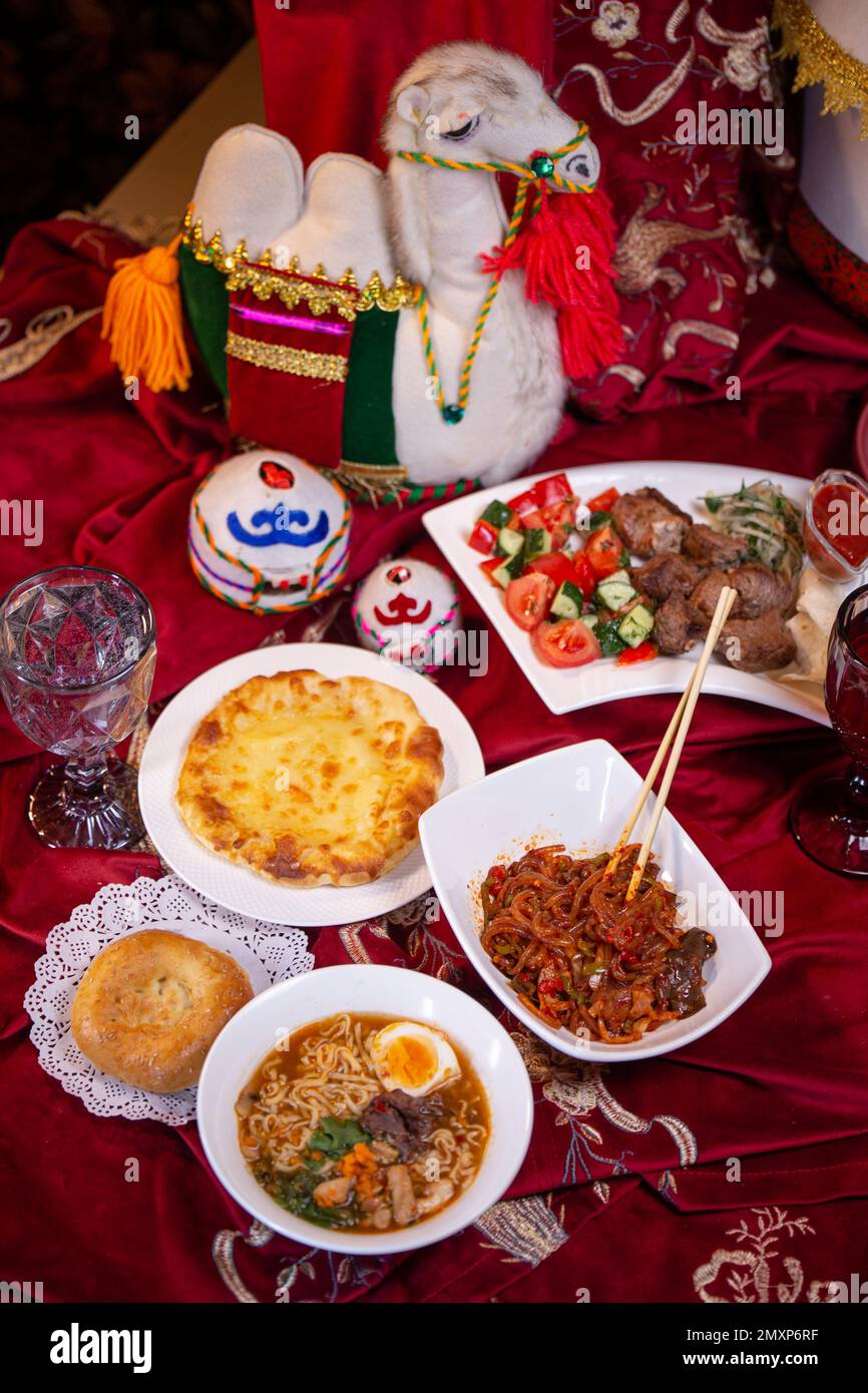 Kazakh festive table with national dishes. traditional dastarkhan Stock