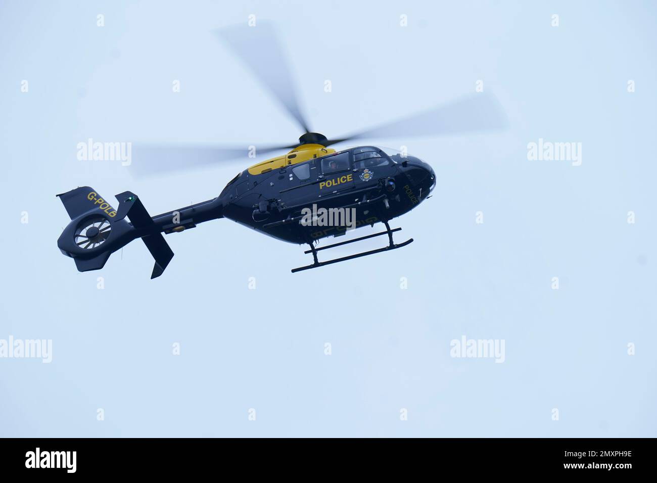 A police helicopter over St Michael's on Wyre, Lancashire, as police continue their search for missing woman Nicola Bulley, 45, who was last seen on the morning of Friday January 27, when she was spotted walking her dog on a footpath by the nearby River Wyre. Picture date: Saturday February 4, 2023. Stock Photo