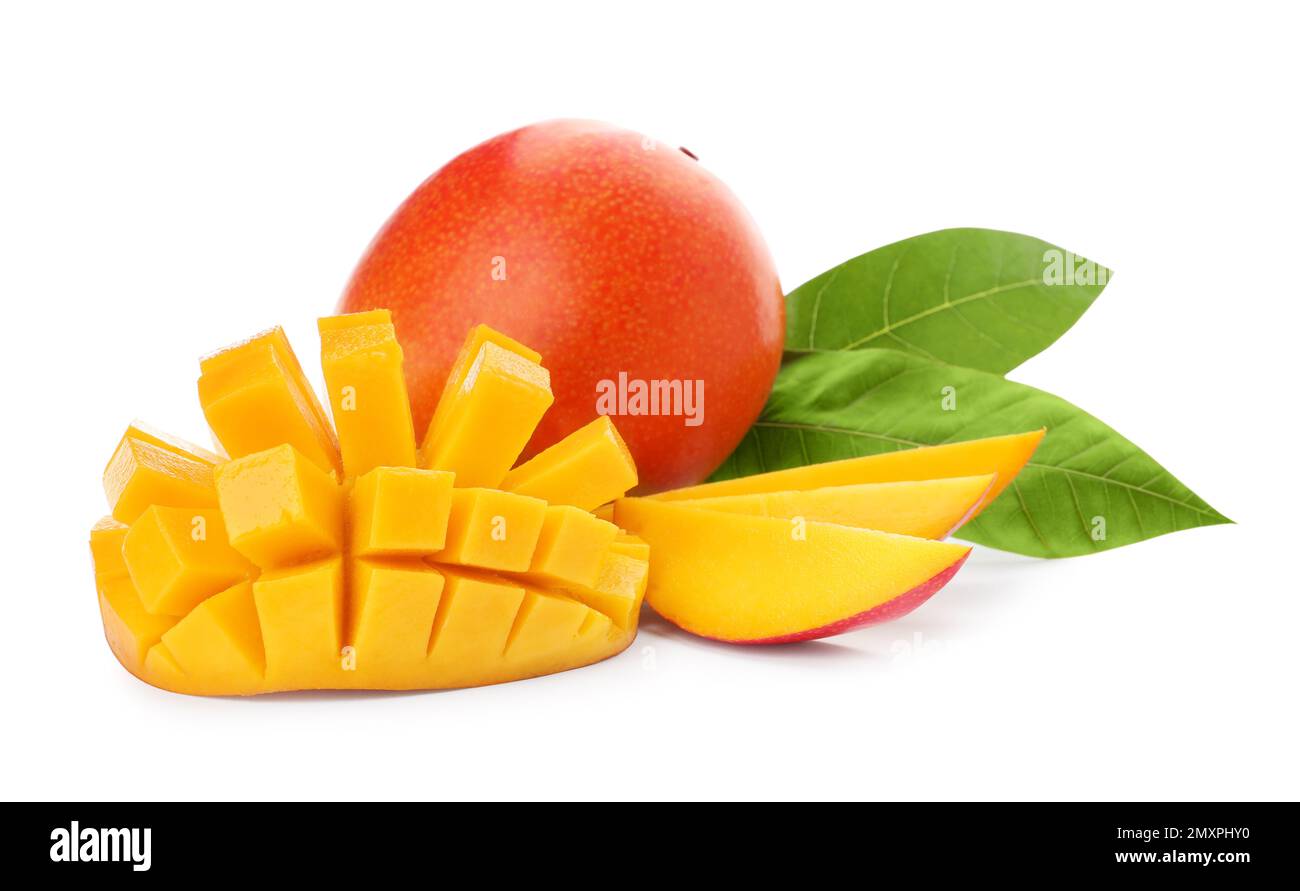 Whole and cut ripe mangoes isolated on white. Exotic fruit Stock Photo ...