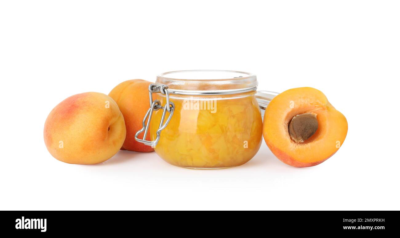 Jar of apricot jam and fresh fruits on white background Stock Photo - Alamy