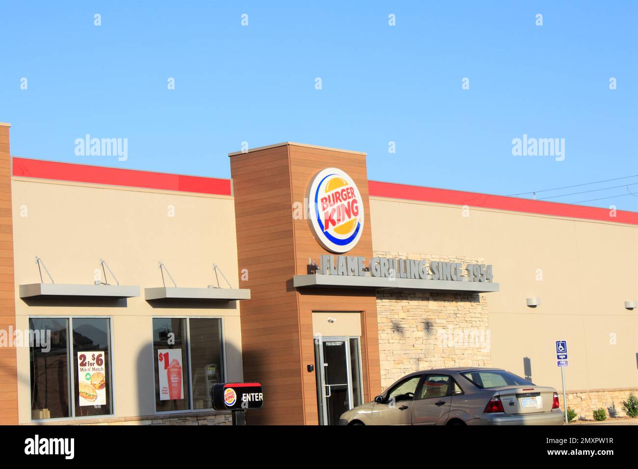 Burger King fast food Restaurant that's bright and colorful with blue sky in Kansas Stock Photo