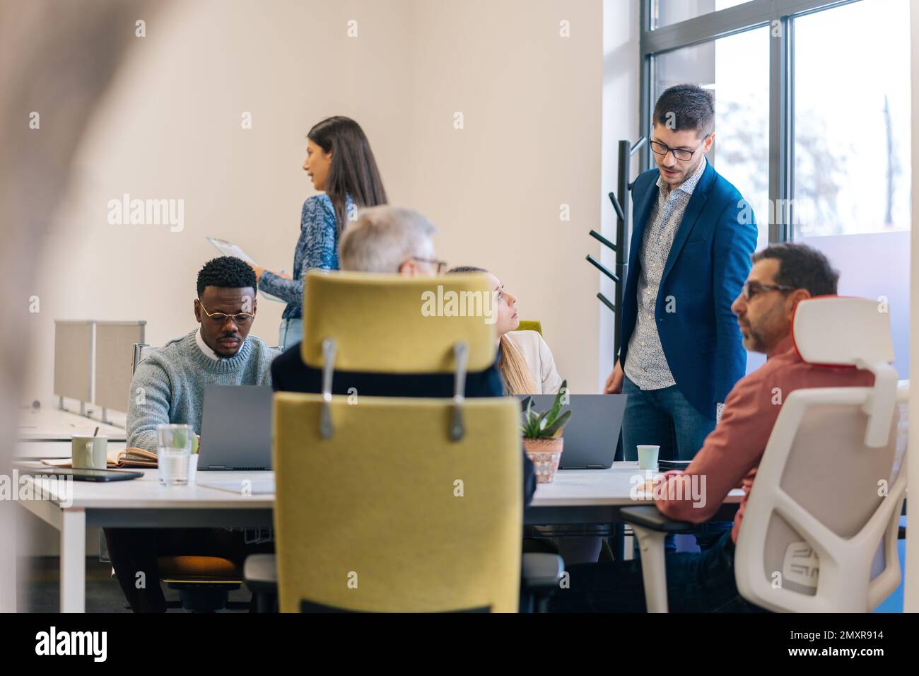 Multicultural people working together in the office Stock Photo - Alamy