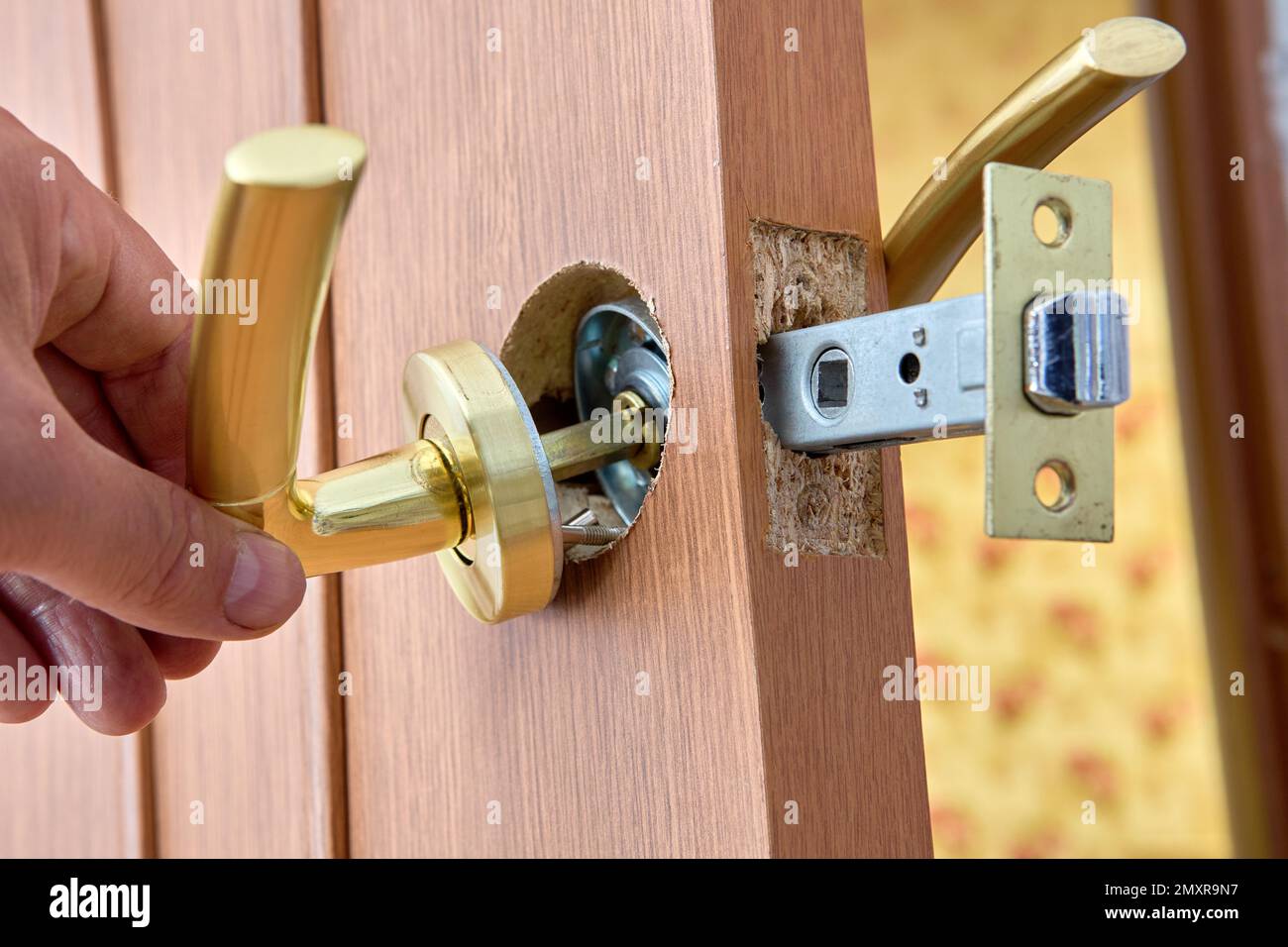 Door latch is placed in groove of interior door to align with door