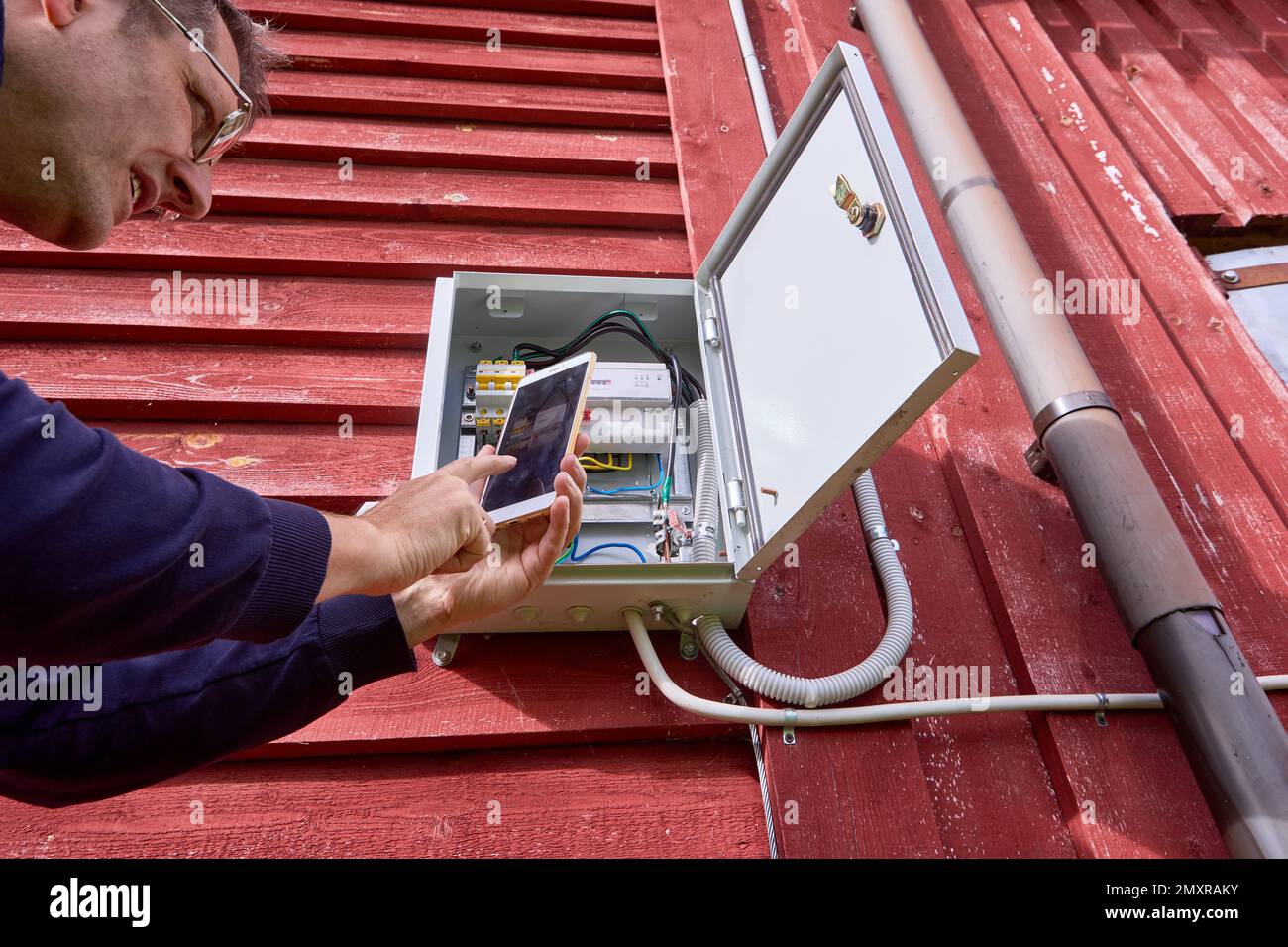 Photographing readings of an external electric meter located in