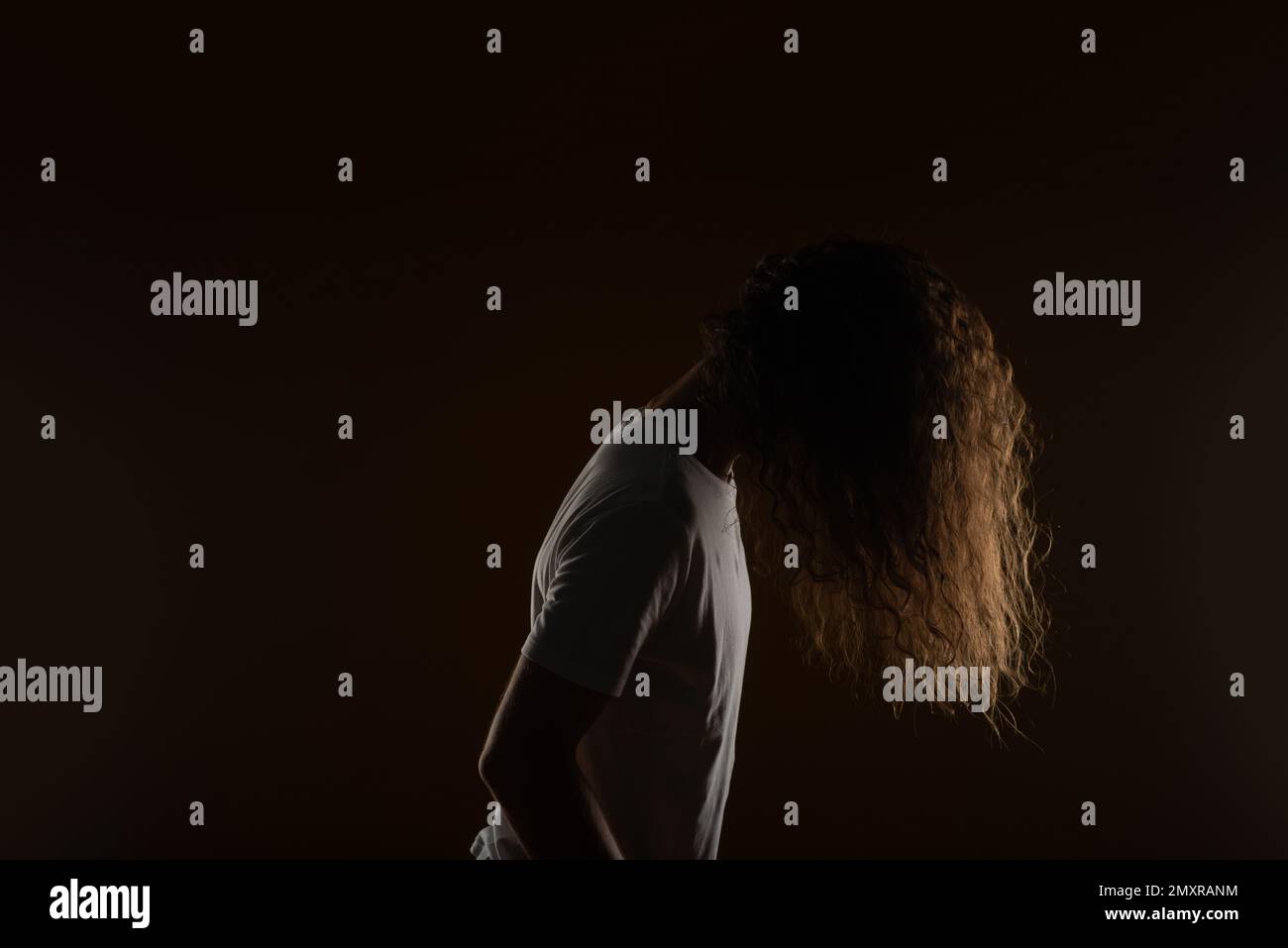 Male with long curly hair. Studio shoot Stock Photo