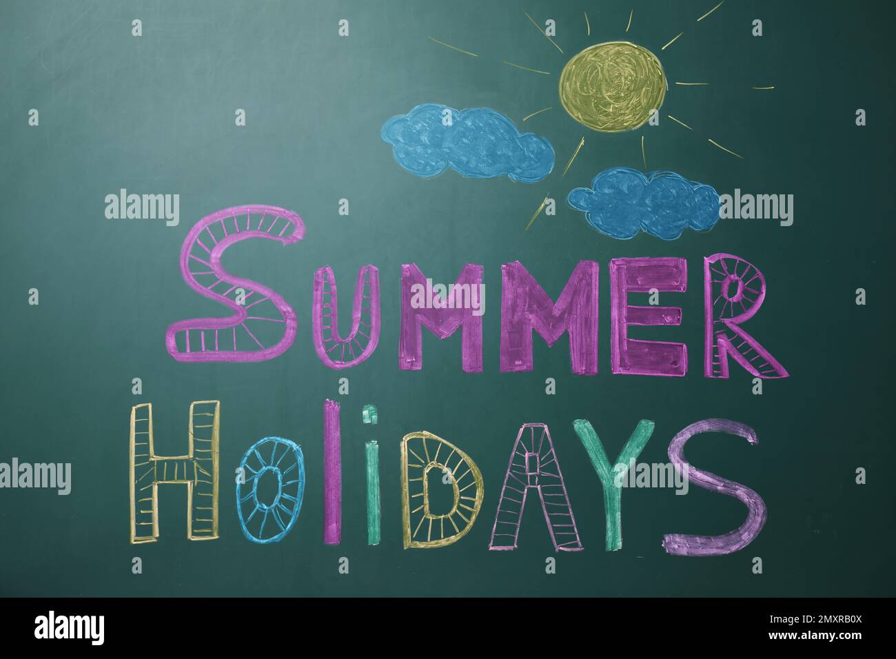Text Summer Holidays written on school chalkboard Stock Photo - Alamy