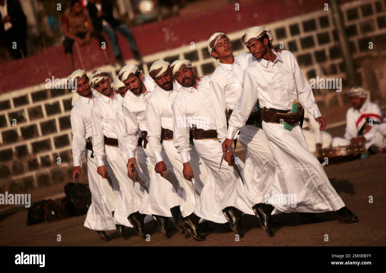 Yemenis perform a traditional dance during a ceremony to mark the ...