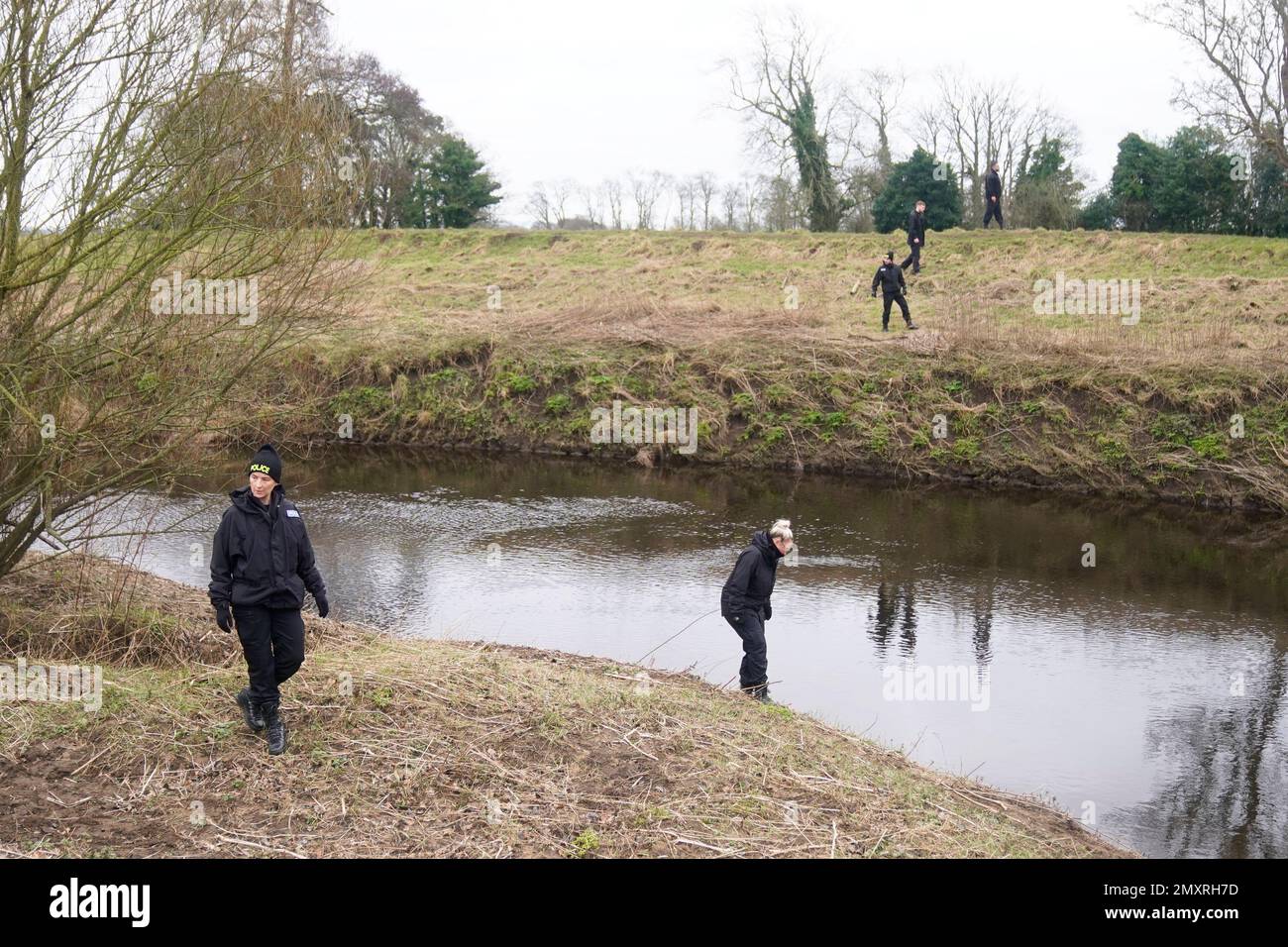 Police officers search near the River Wyre in St Michael's on Wyre, Lancashire, as police continue their search for missing woman Nicola Bulley, 45, who was last seen on the morning of Friday January 27, when she was spotted walking her dog on a footpath by the nearby River Wyre. Picture date: Saturday February 4, 2023. Stock Photo