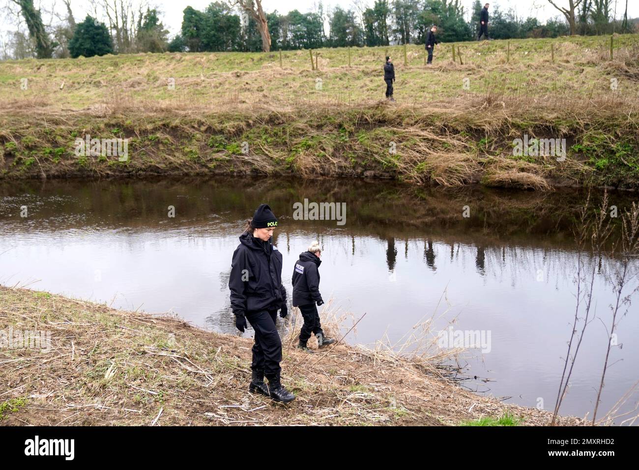 Police officers search near the River Wyre in St Michael's on Wyre, Lancashire, as police continue their search for missing woman Nicola Bulley, 45, who was last seen on the morning of Friday January 27, when she was spotted walking her dog on a footpath by the nearby River Wyre. Picture date: Saturday February 4, 2023. Stock Photo