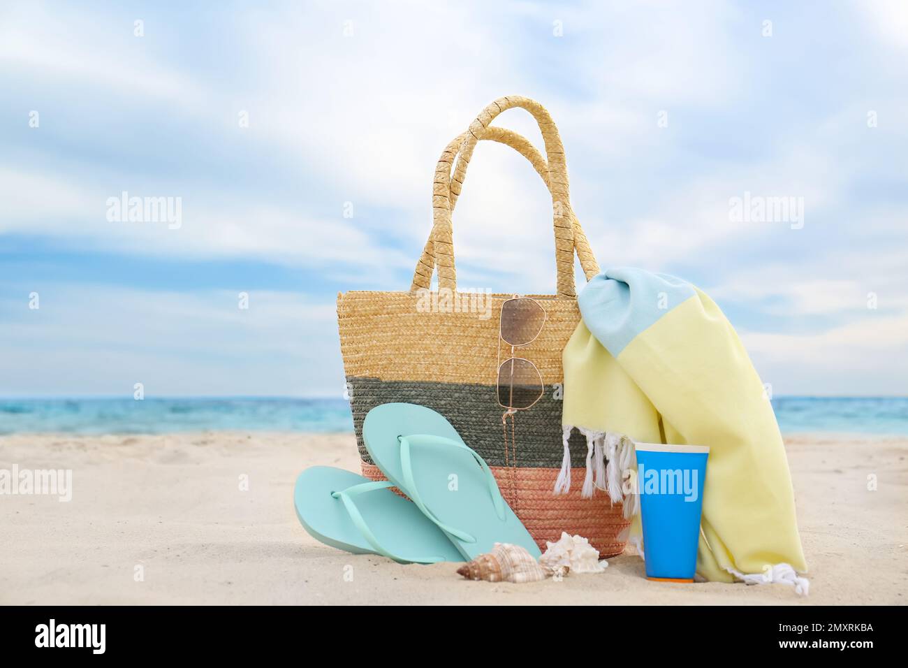 Stylish Striped Bag Slippers Seashell Sandy Beach Sea Stock Photo by  ©NewAfrica 616479018