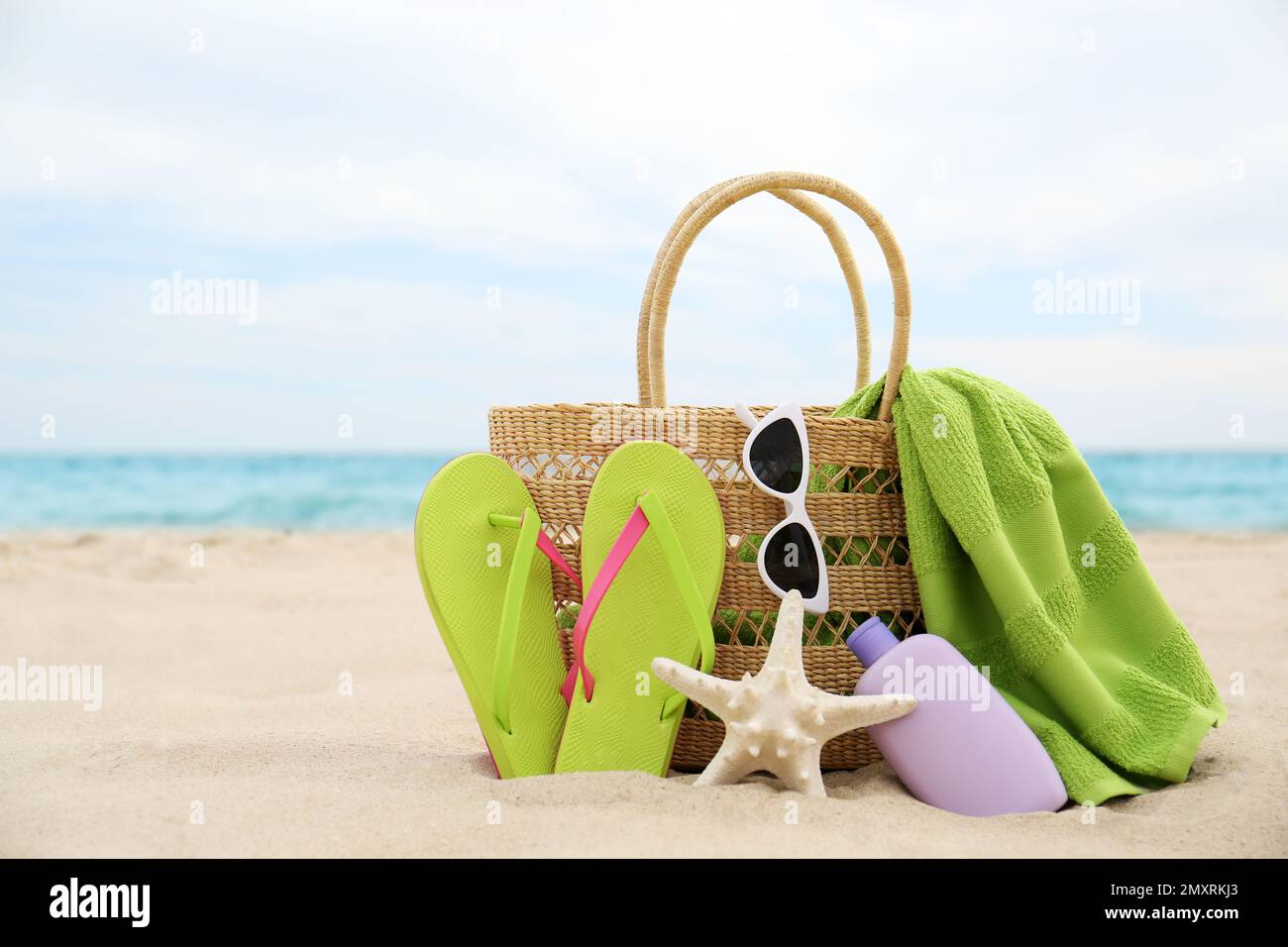 Different stylish beach objects and starfish on sand near sea Stock ...