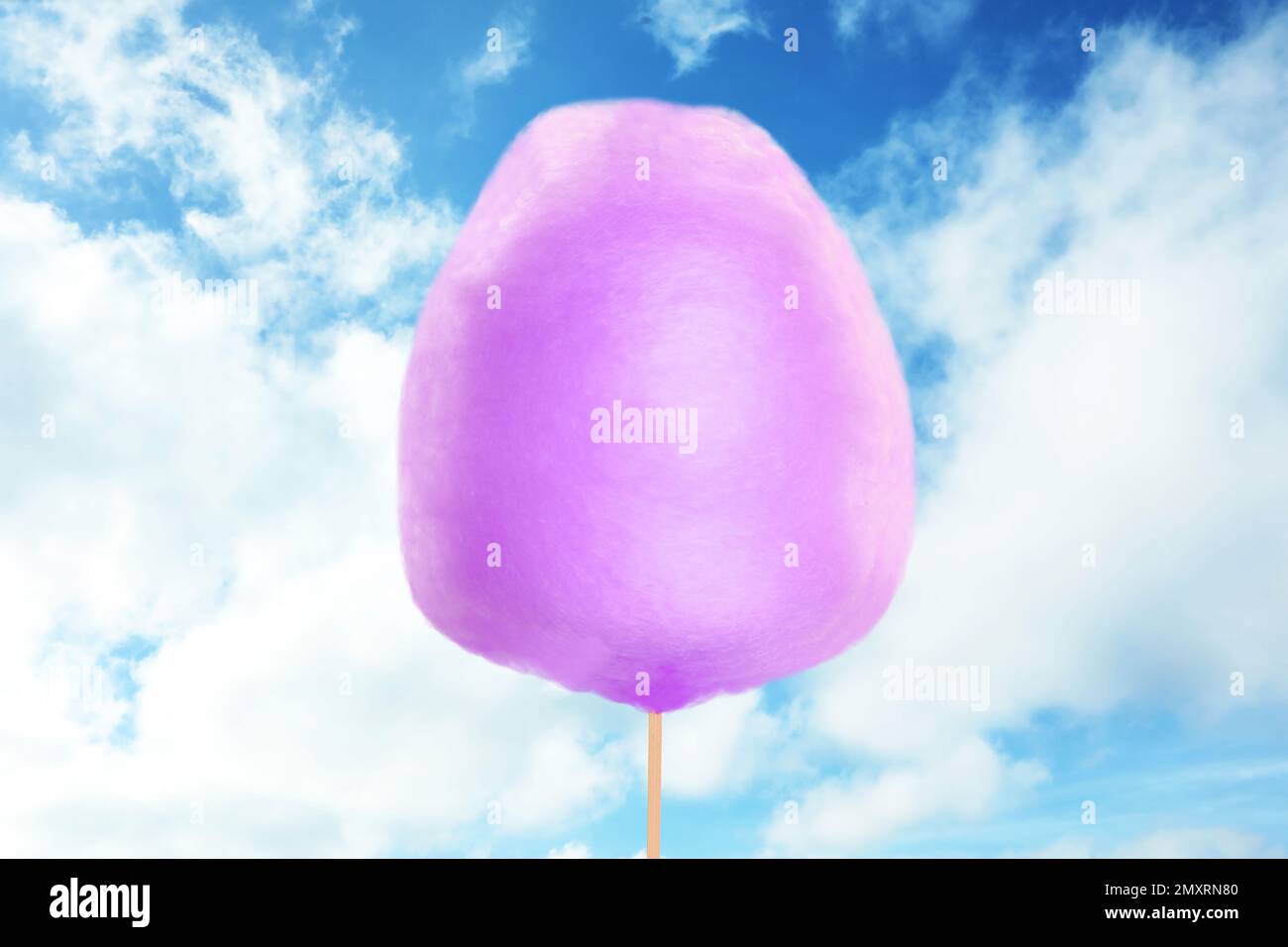 Purple cotton candy against blue sky with clouds Stock Photo Alamy