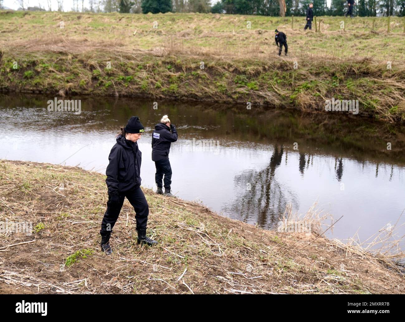 Police officers search near the River Wyre in St Michael's on Wyre, Lancashire, as police continue their search for missing woman Nicola Bulley, 45, who was last seen on the morning of Friday January 27, when she was spotted walking her dog on a footpath by the nearby River Wyre. Picture date: Saturday February 4, 2023. Stock Photo