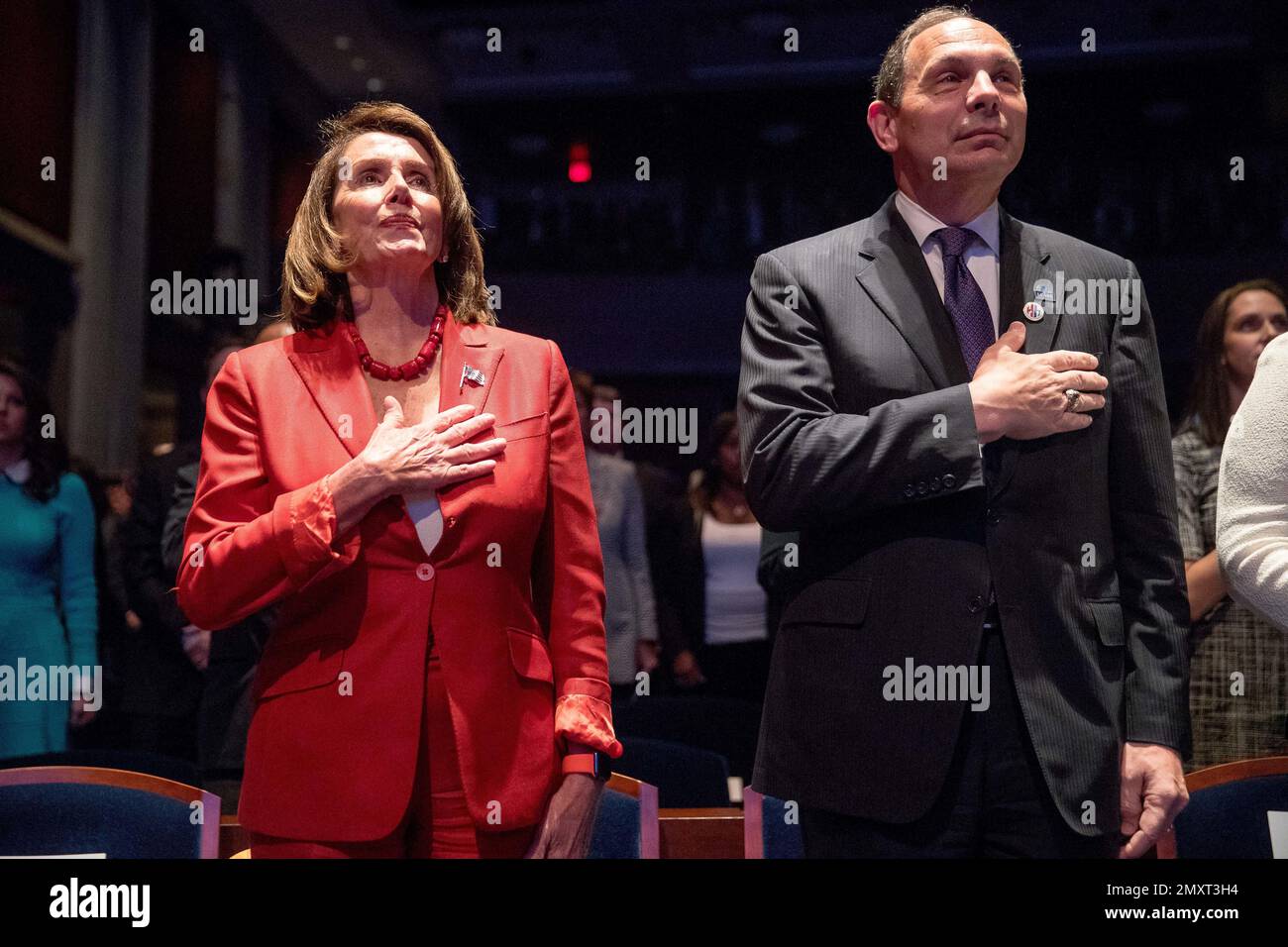 House Minority Leader Nancy Pelosi of Calif., left, and Veterans Affairs Secretary Robert McDonald, stand for the Pledge of Allegiance at the launch of 'Hidden Heroes' campaign, Tuesday, Sept. 27, 2016, on Capitol Hill in Washington. Former Sen. North Carolina Elizabeth Dole commissioned the RAND Corporation to develop the first nationwide comprehensive, evidence-based report on the needs of military and veteran caregivers. (AP Photo/Andrew Harnik) Stock Photo